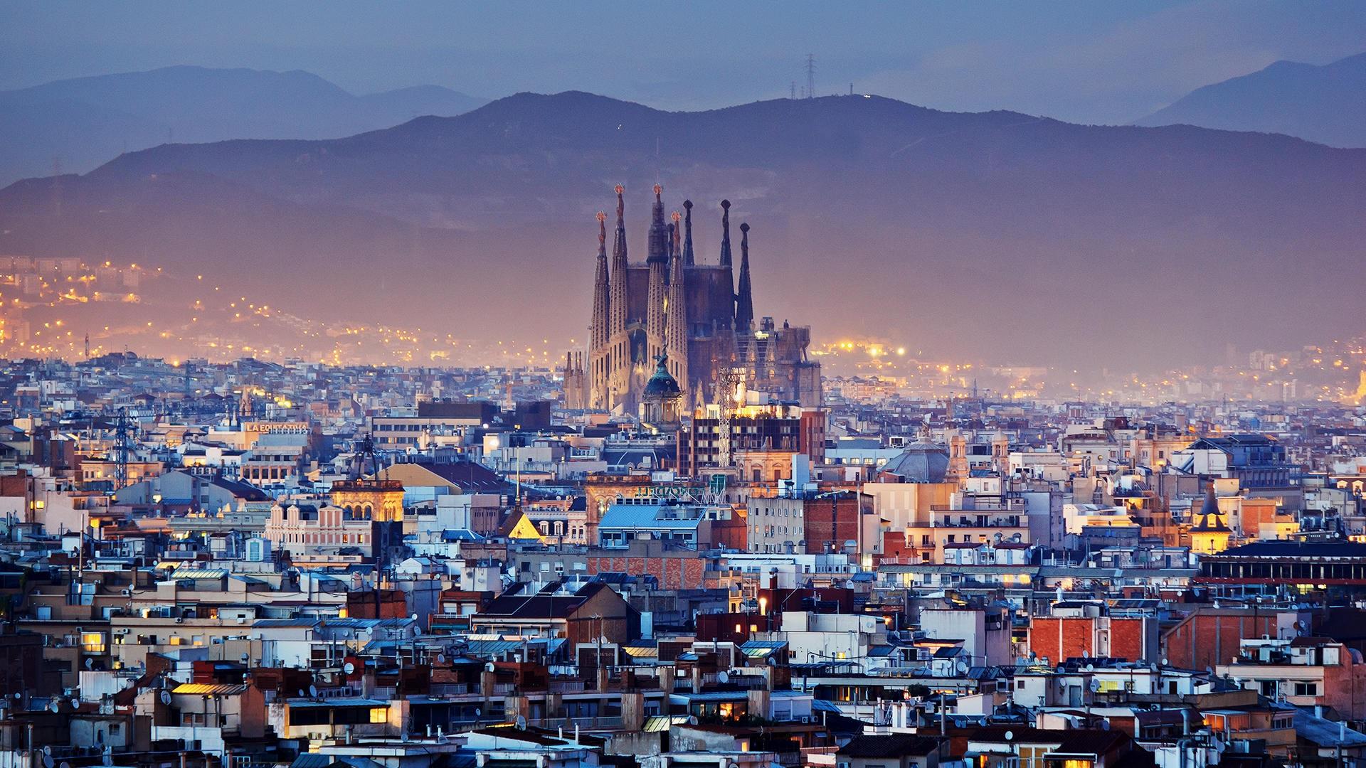 Sagrada Familia cathedral and Barcelona at twilight