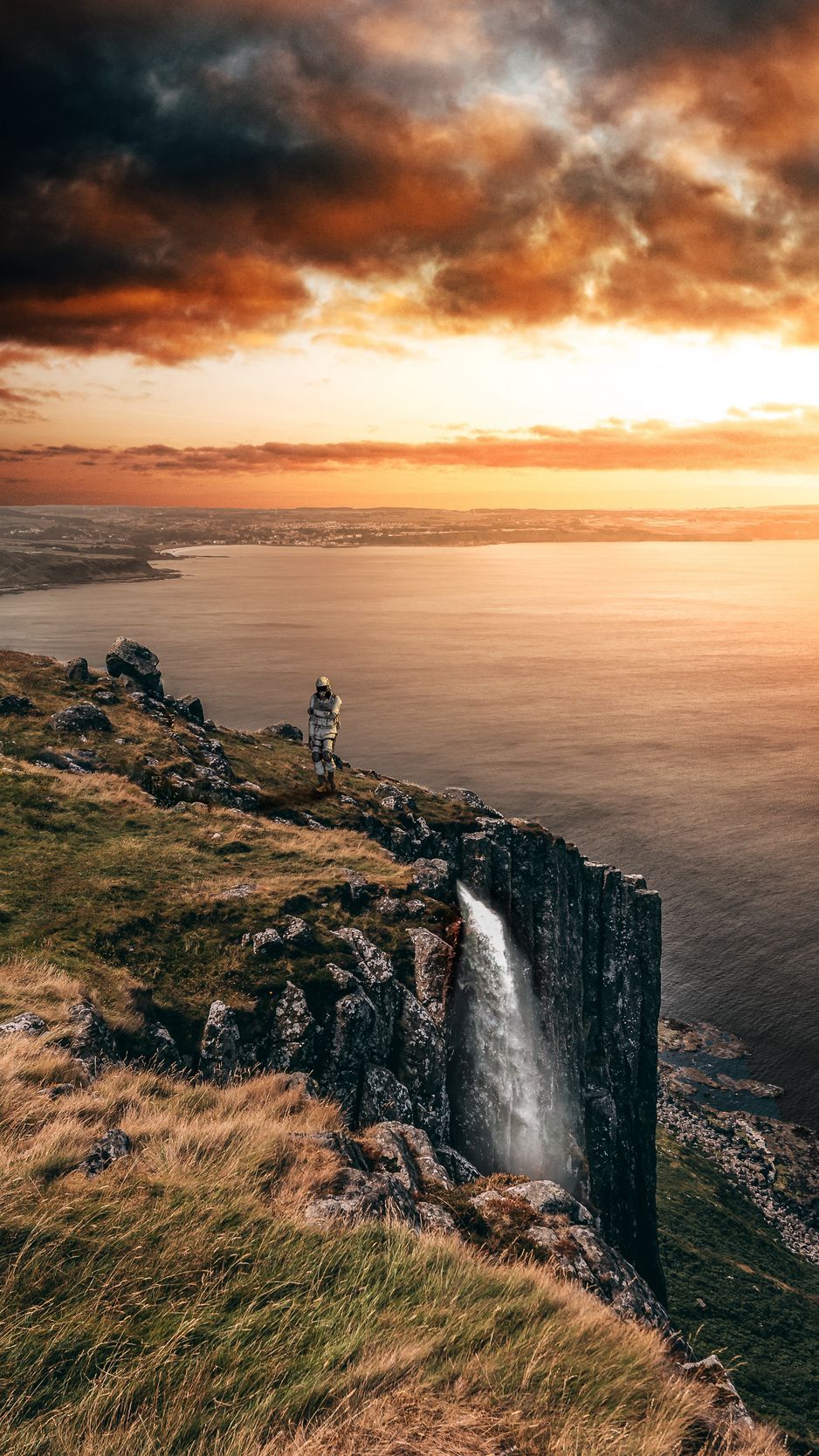Download wallpaper 938x1668 sea, cliff, waterfall, sunset