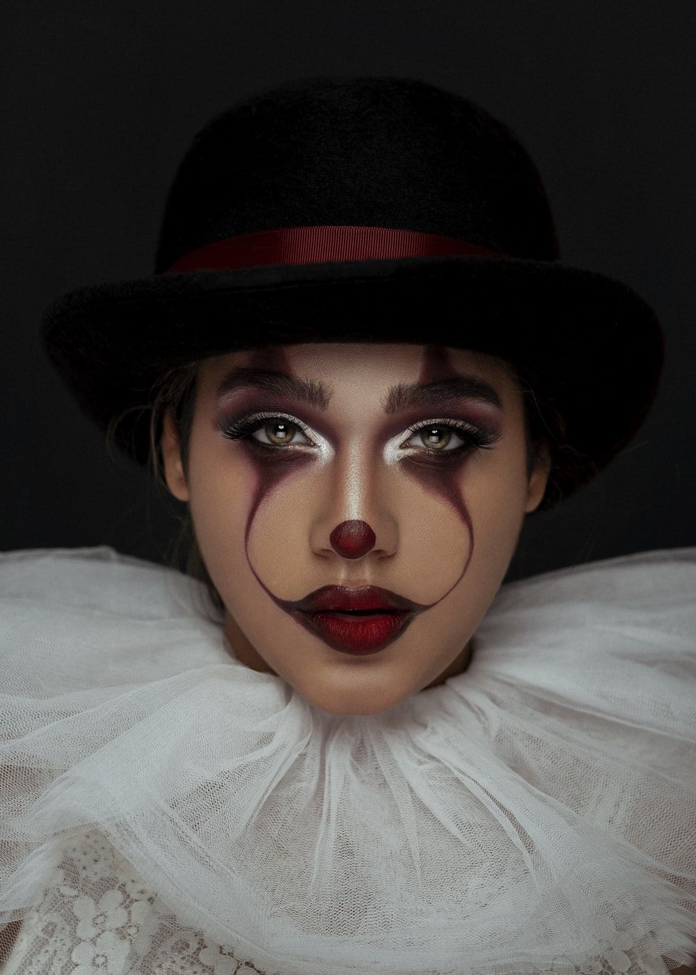 woman using joker makeup photo