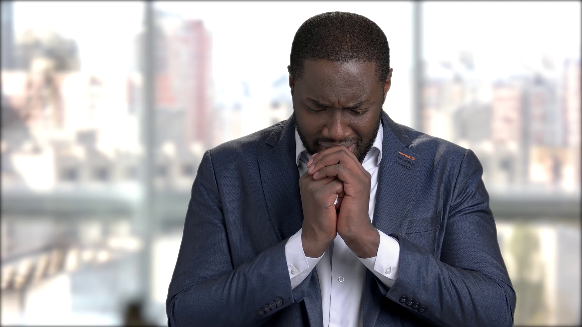 Afro American Businessman Is Crying On Blurred Background