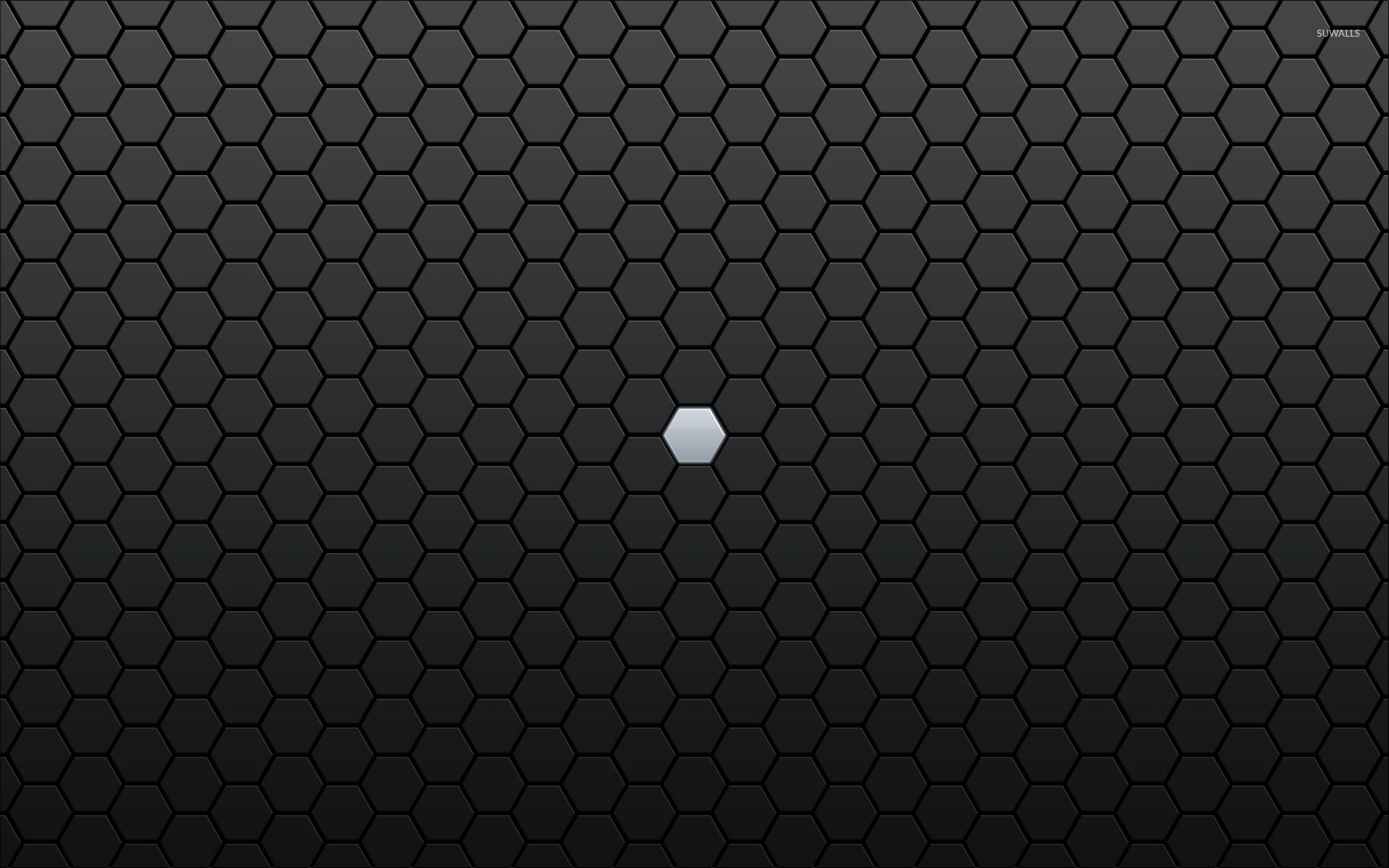 Gray hexagon lost between black ones wallpaper