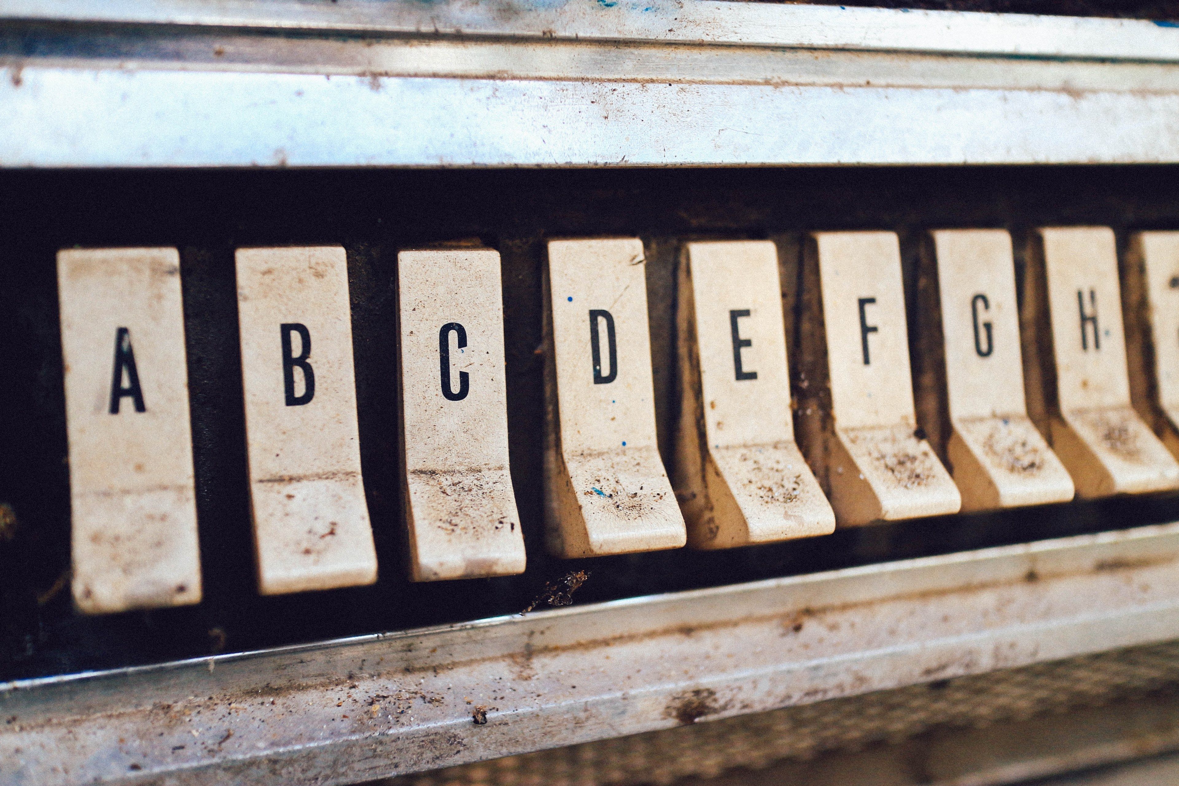 letter buttons on an old dirty jukebox typography 4k wallpaper