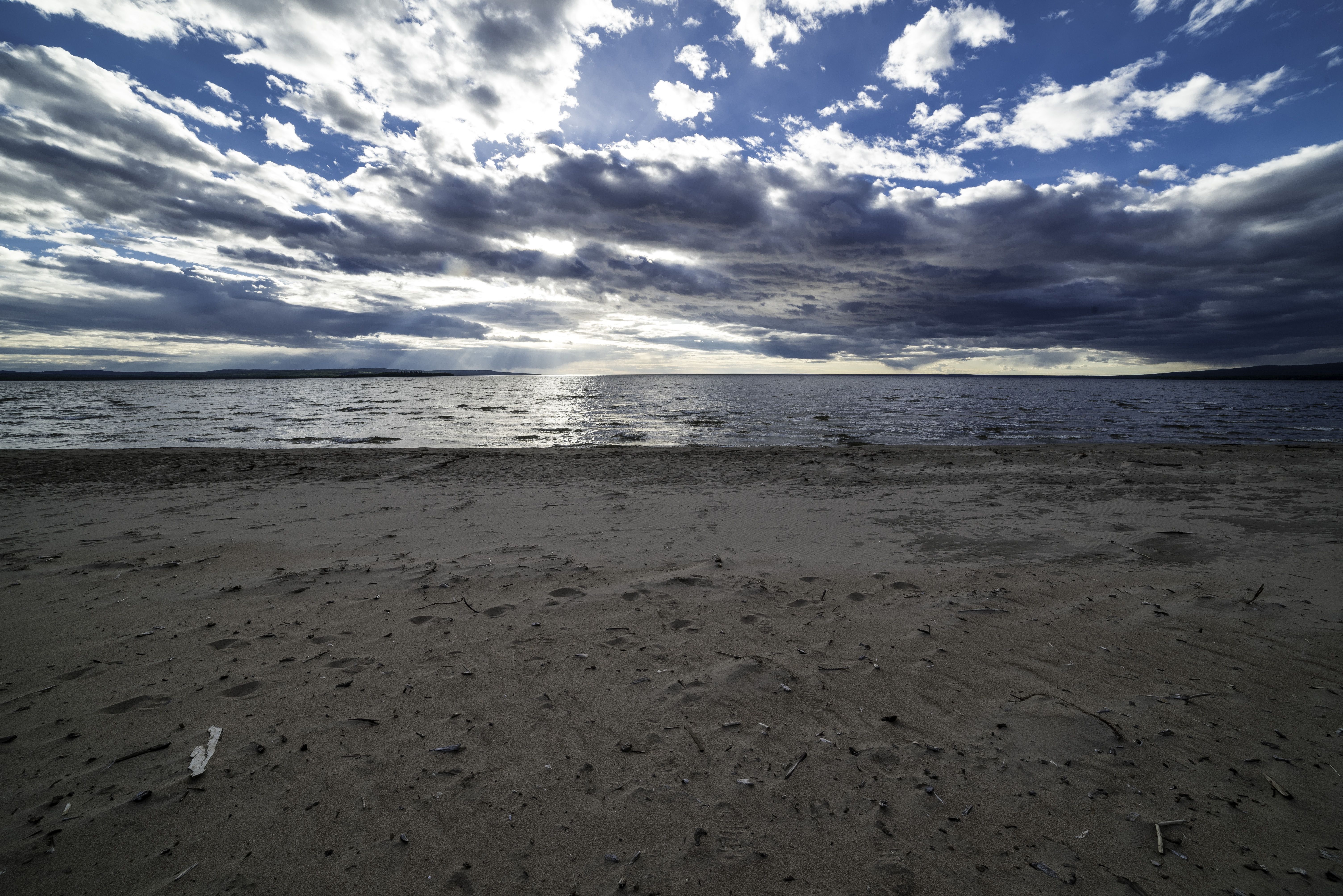 Beach and Shoreline with clouds and sky with sun image