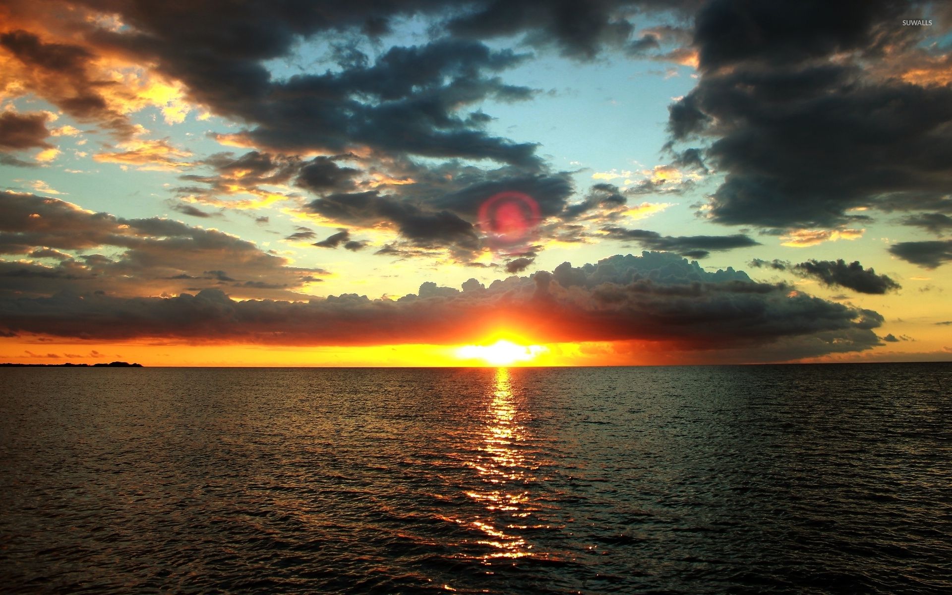 Golden sunset under the dark clouds wallpaper wallpaper