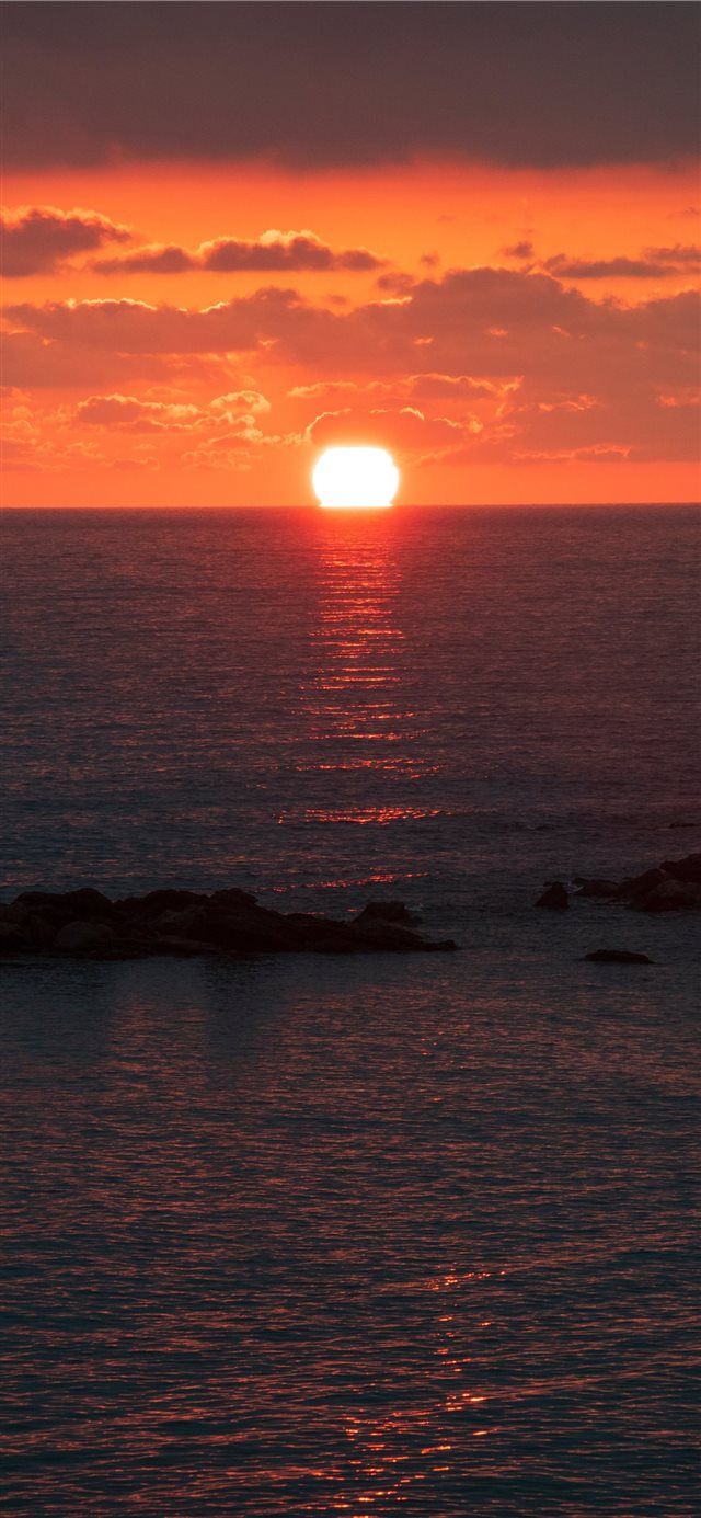 sunset under nimbus clouds iPhone X Wallpaper Free Download