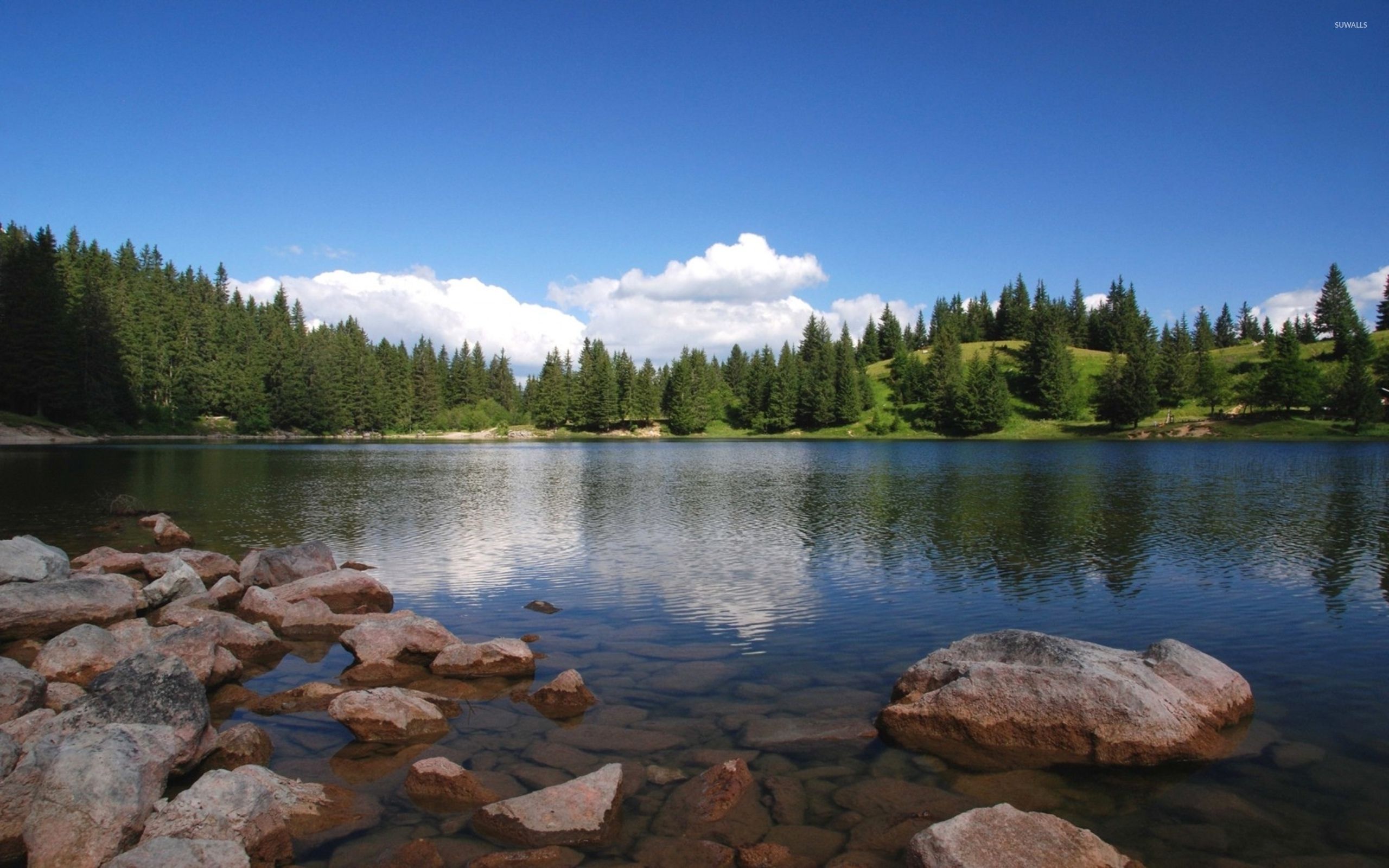 Clear blue sky above the wrinkled lake