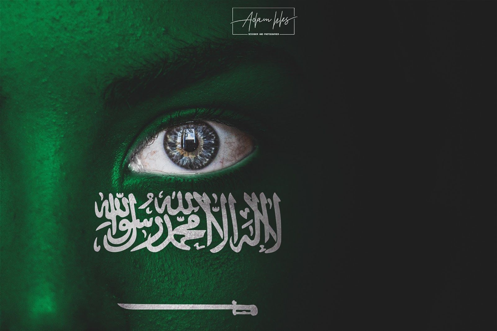 Photo of the flag of Saudi on the face of a child's background