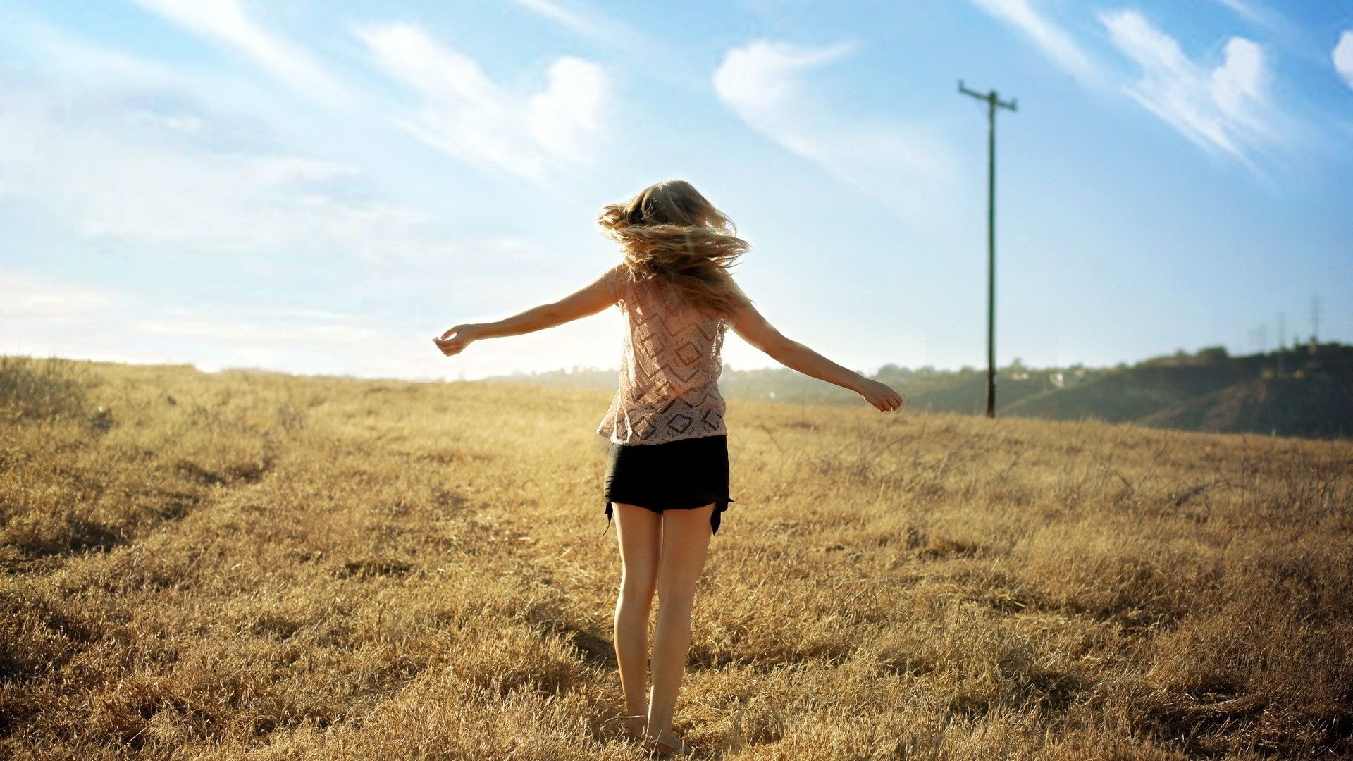 Girl Field Wind Sky Enjoying desktop PC and Mac wallpaper