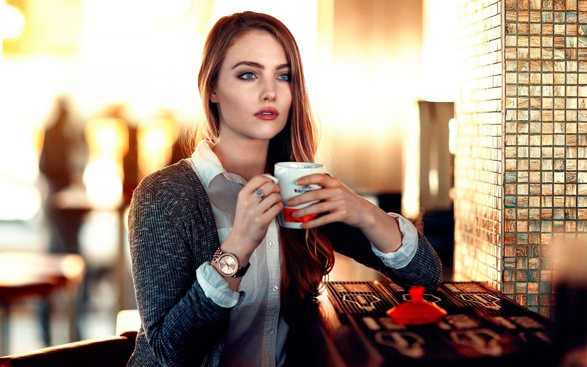 #open mouth, #blouses, #redhead, #long hair, #depth of field, #Alessandro Di Cicco, #model, #women, #watches, #sitting, #sweater, #blue eyes, #looking away, #cup, #restaurant wallpaper. Mocah.org HD Wallpaper