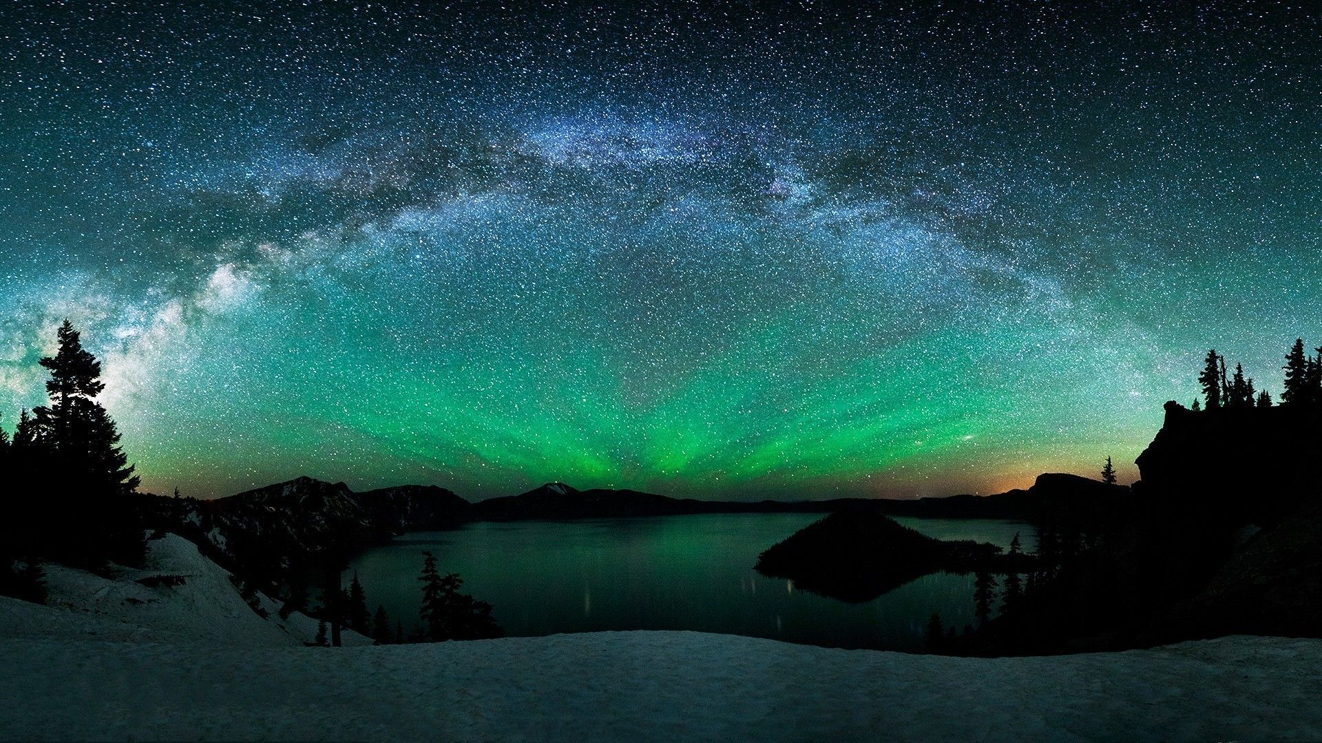 Aurora Borealis and the Milky Way above the mountain lake