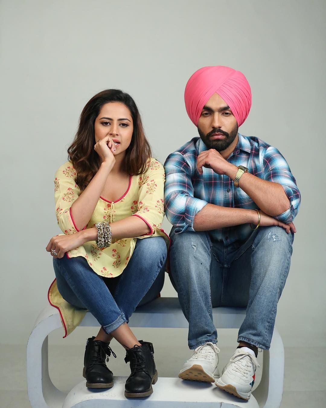 Image may contain: 2 people, people sitting and shoes. Romantic