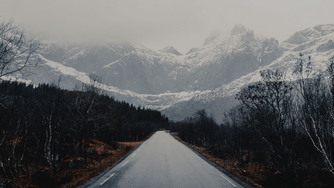 Download wallpaper 1366x768 road, mountains, trees, asphalt, wet