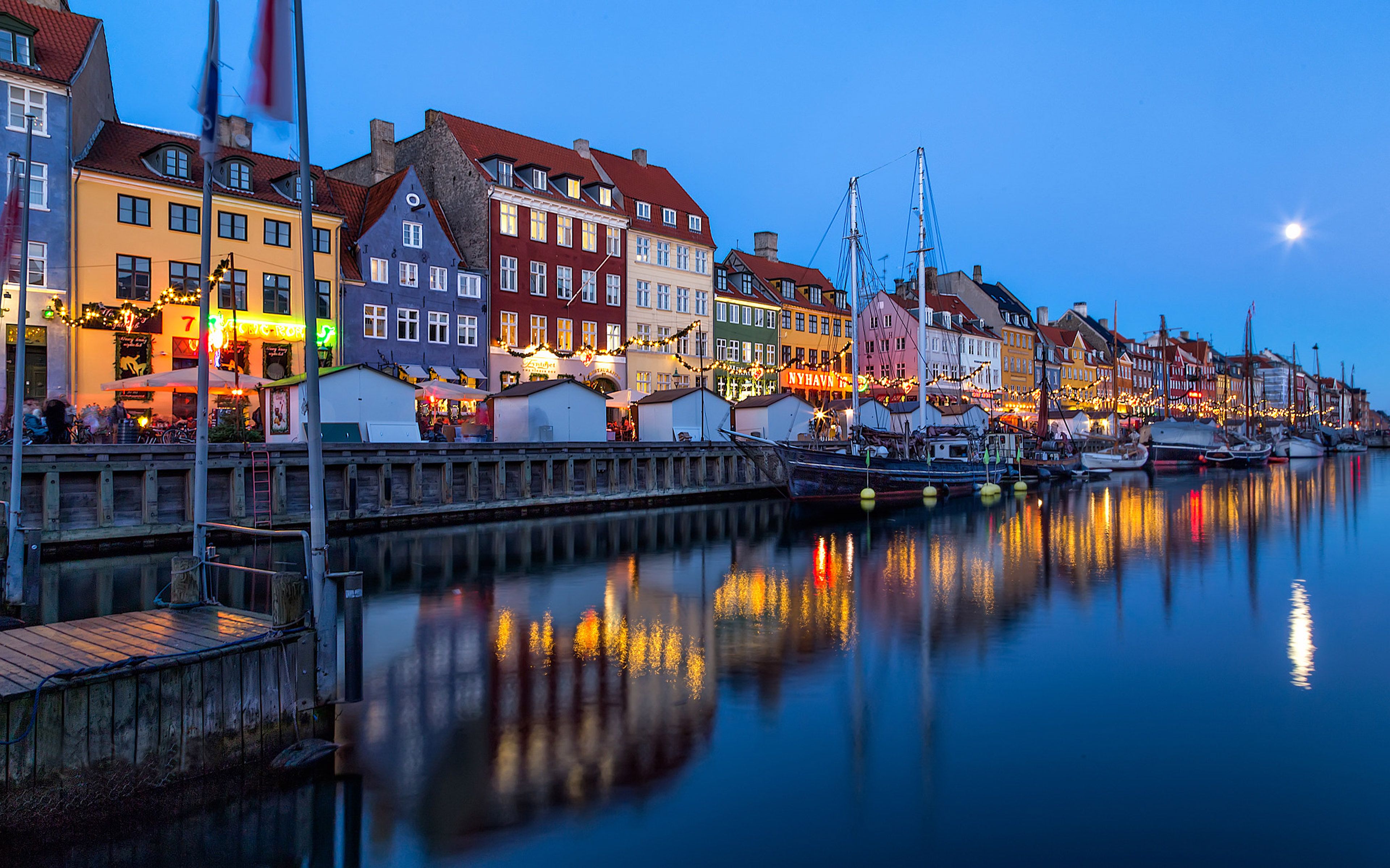Nyhavn District On Shore Channel And Entertainment In Copenhagen