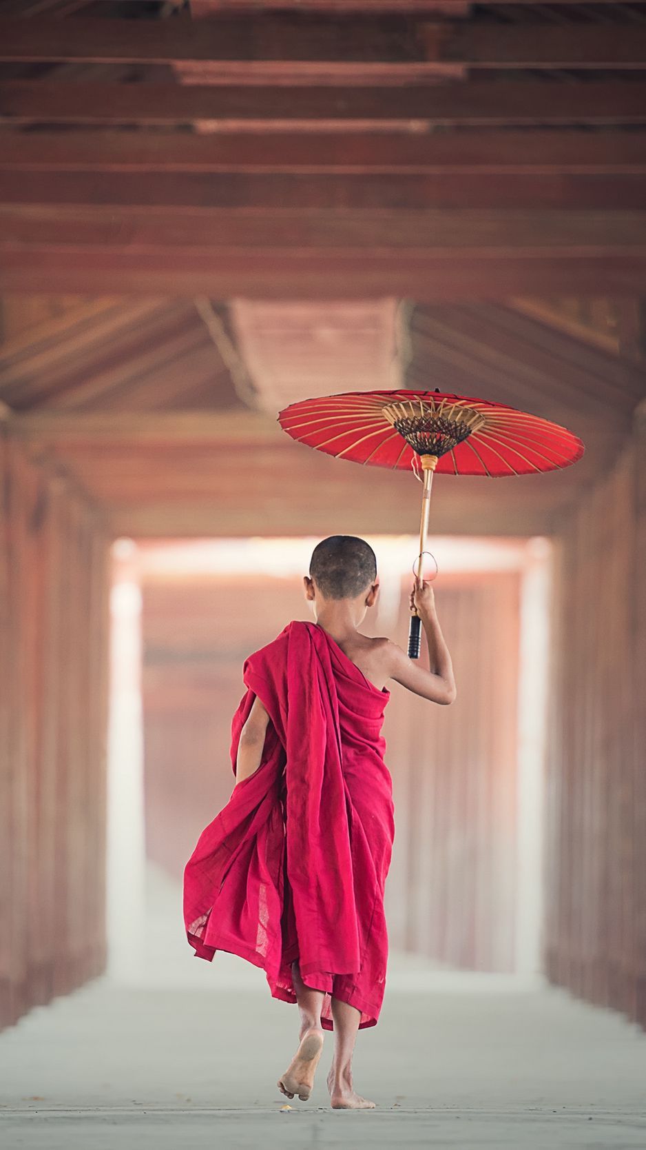 Download wallpaper 938x1668 boy, monk, child, umbrella, buddhism