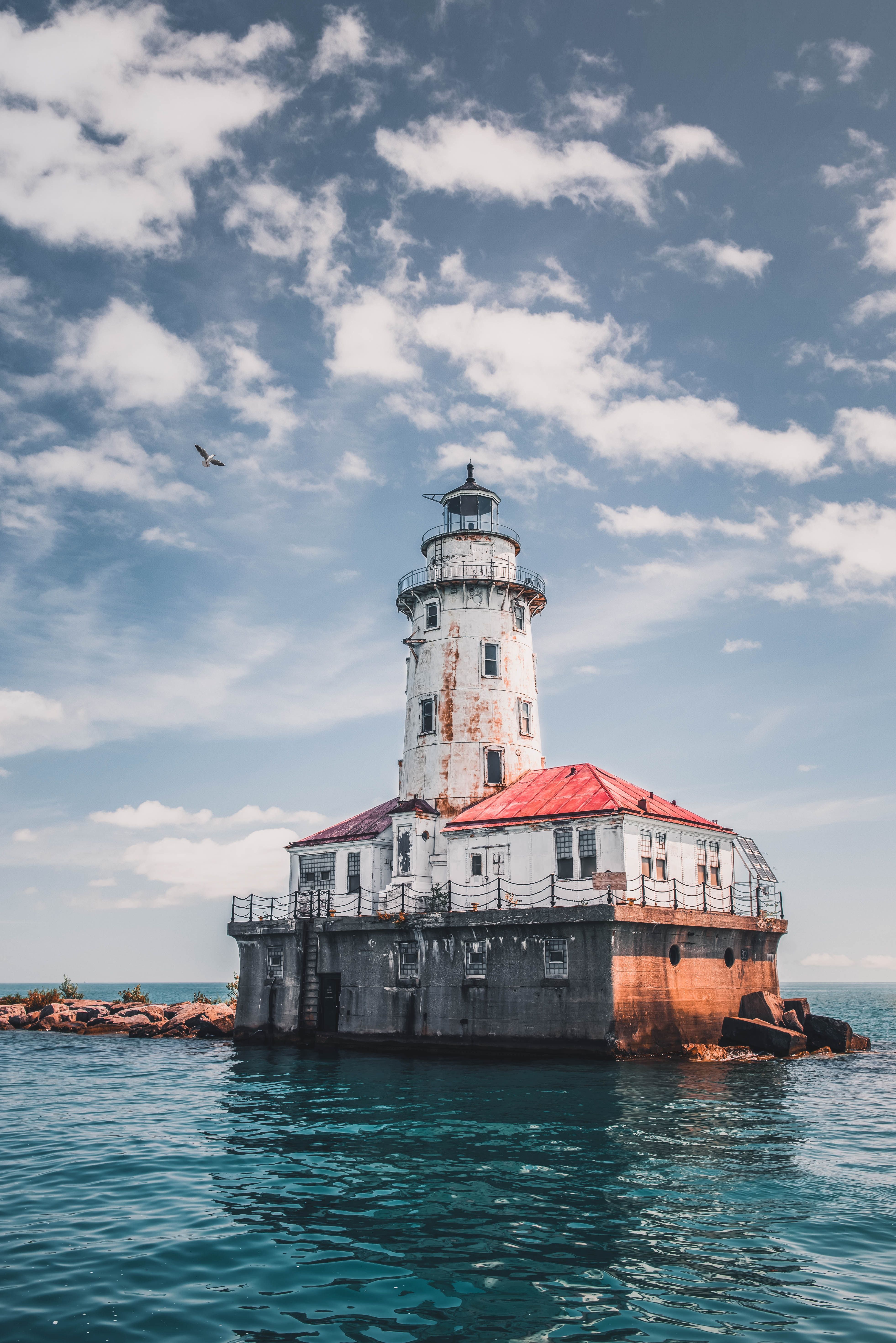 White Lighthouse Under Cloudy Sky · Free