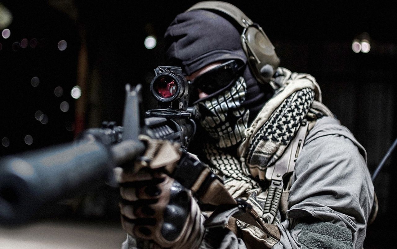 Soldier holding rifle wallpaper. Soldier holding rifle