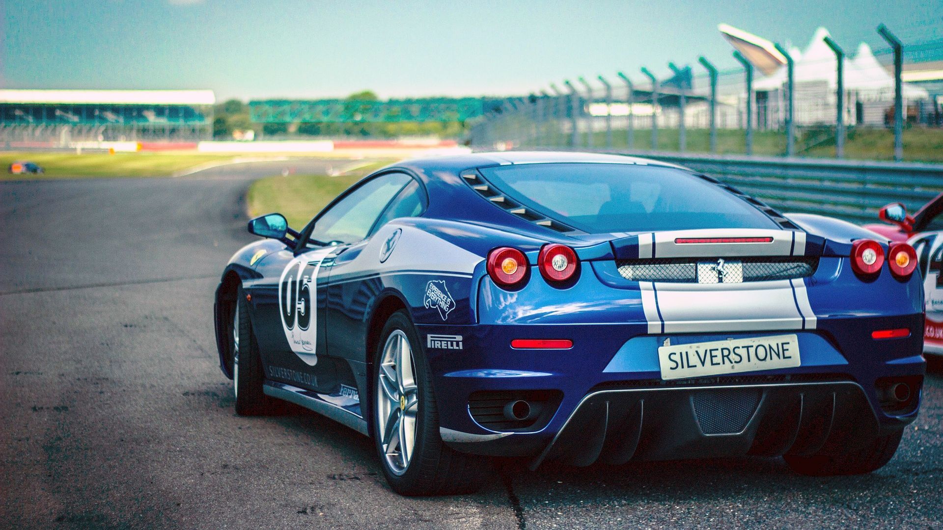 Metallic Blue Ferrari Car Racing View Wallpaper