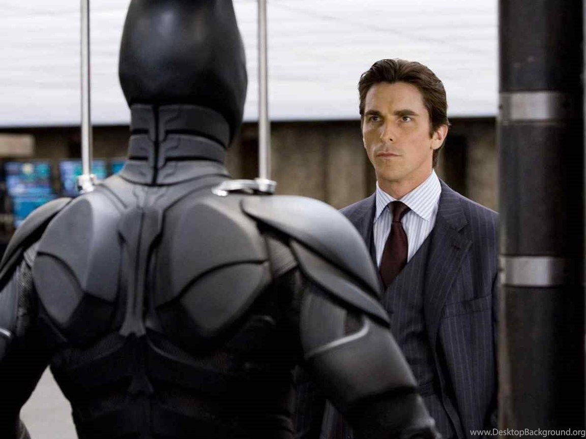 Download Bruce Wayne Looking At Batman Costume Wallpaper
