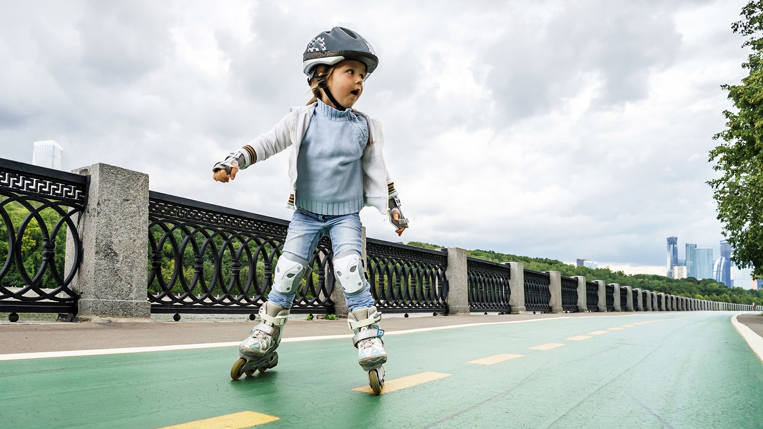 Desktop Wallpaper Little girls Helmet child Roller skates 2560x1440