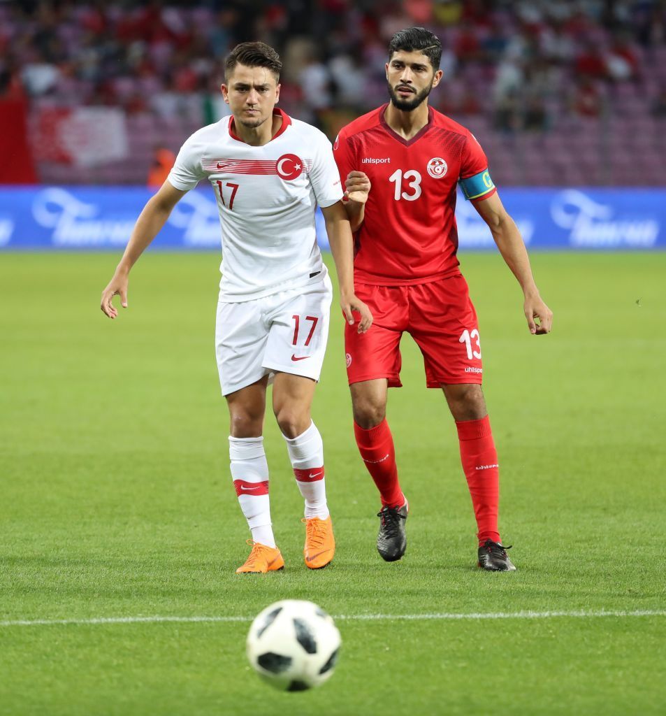 Cengiz Under of Turkey in action against Ferjani Sassi of Tunisia