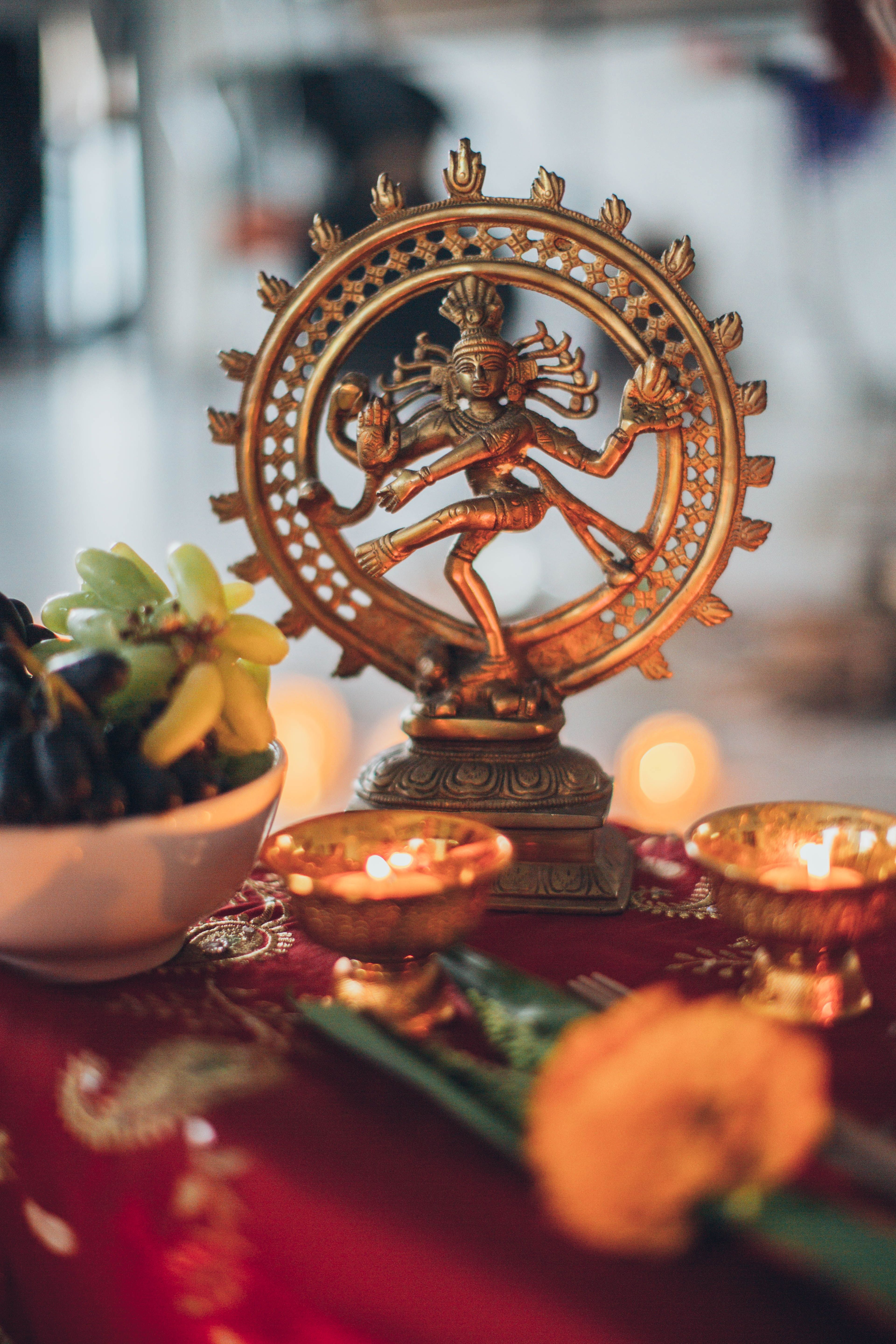 Shiva Nataraja Figurine Surrounded by Lighted Tealights · Free