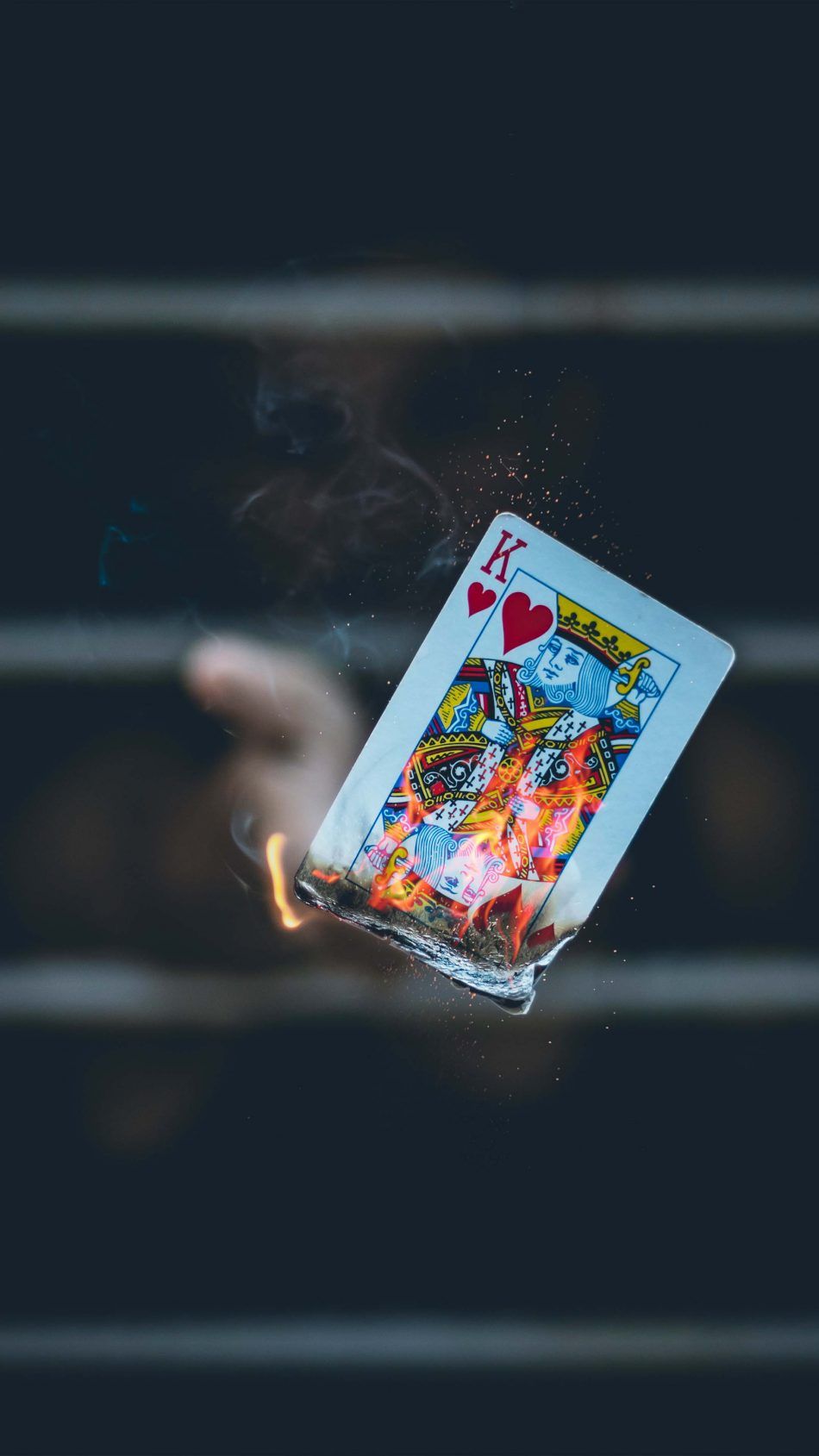 King of Card Hand Flame Portrait Dark Background 4K Ultra HD Mobile Wallpaper