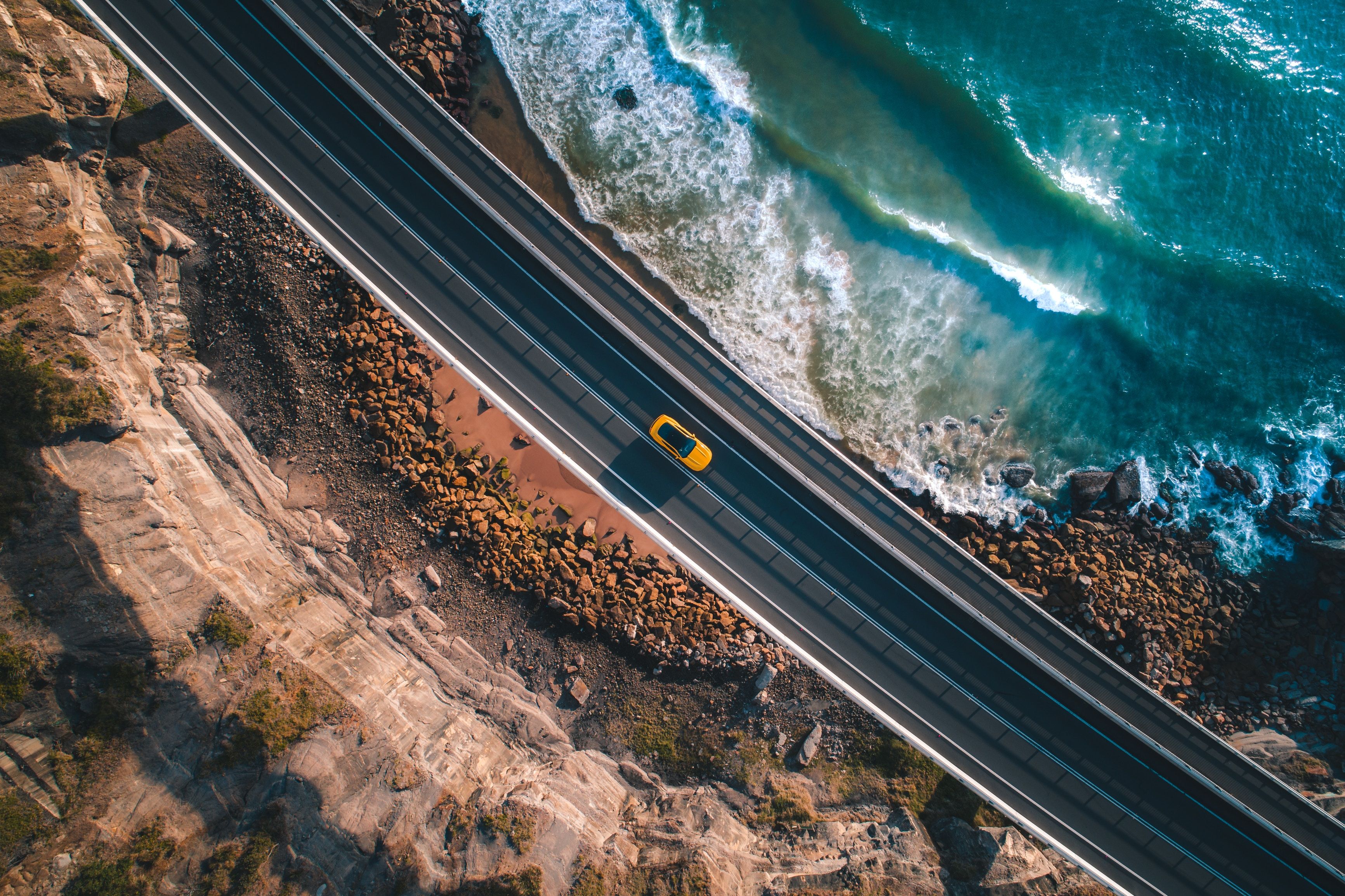 Aerial View of a Highway near the Ocean HD Wallpaper. Background