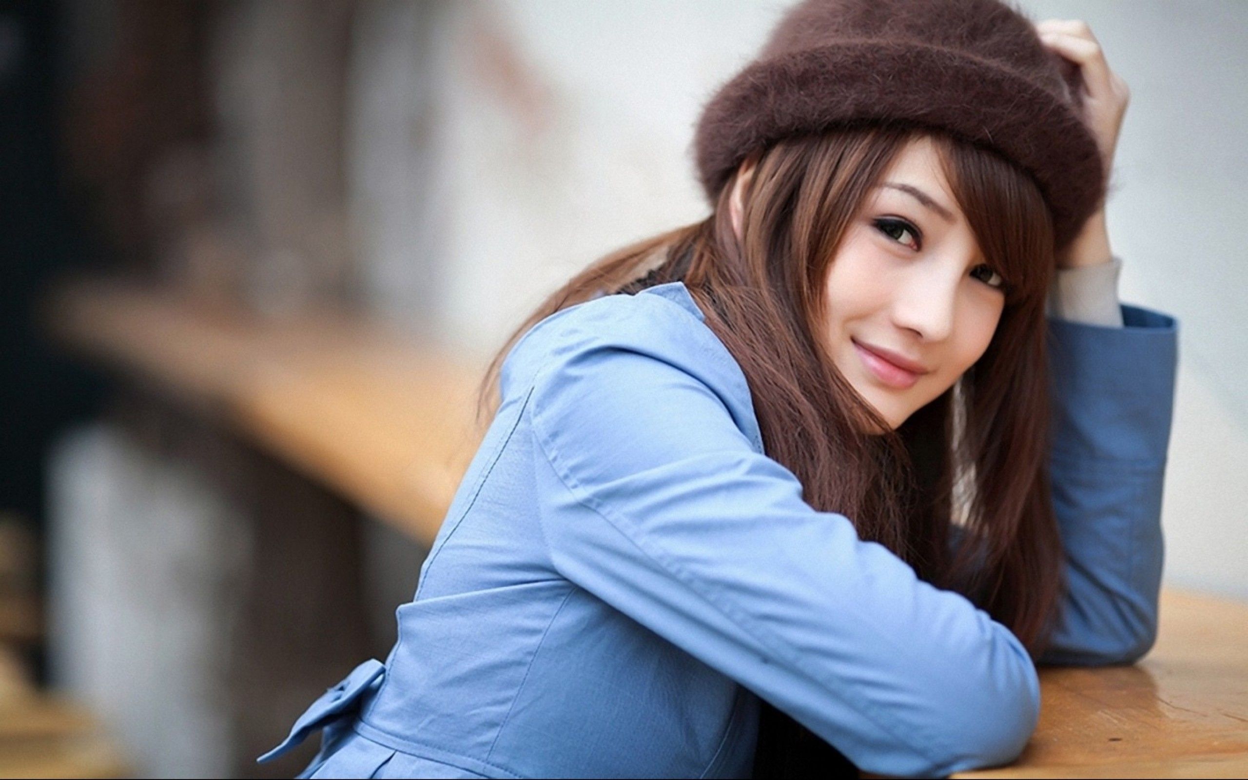 Cute Girl wearing Blue Jacket & Brown Cap Wallpaper