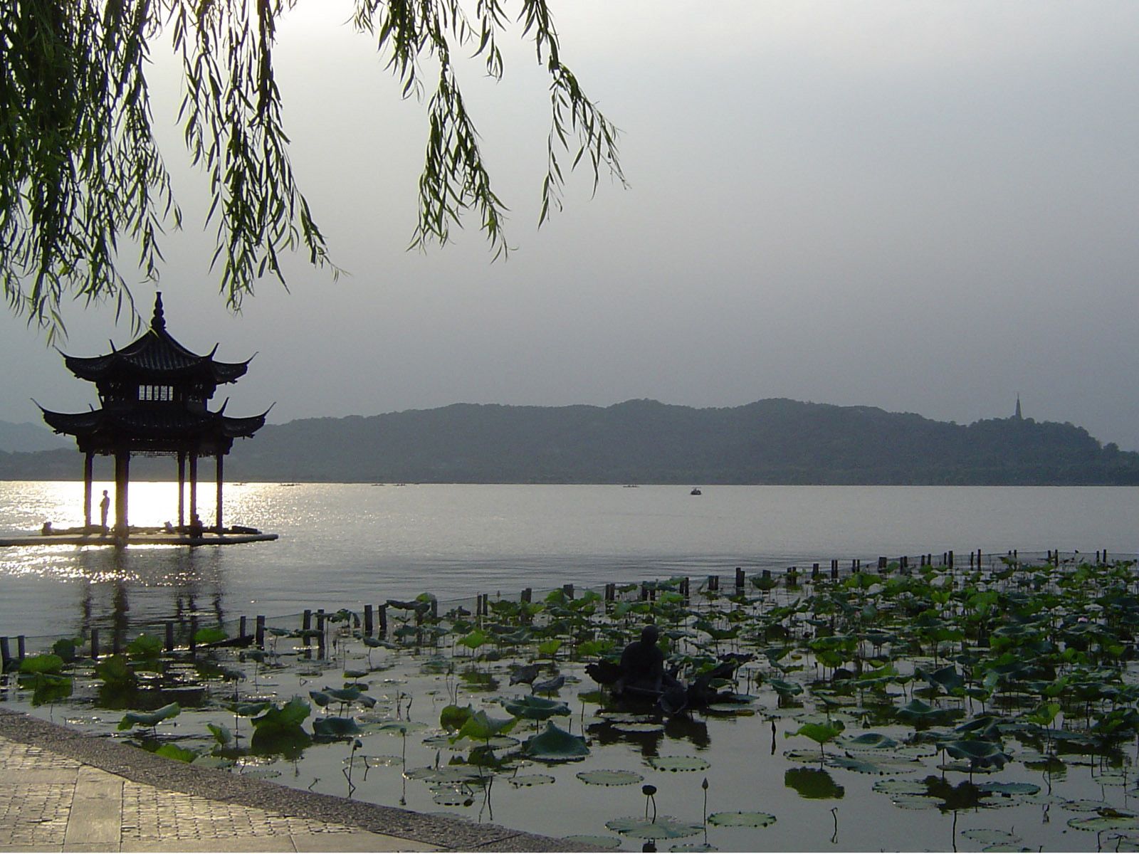 People at the pagoda on the West Lake, the big tourist attraction of  Hangzhou in China stock photo - OFFSET