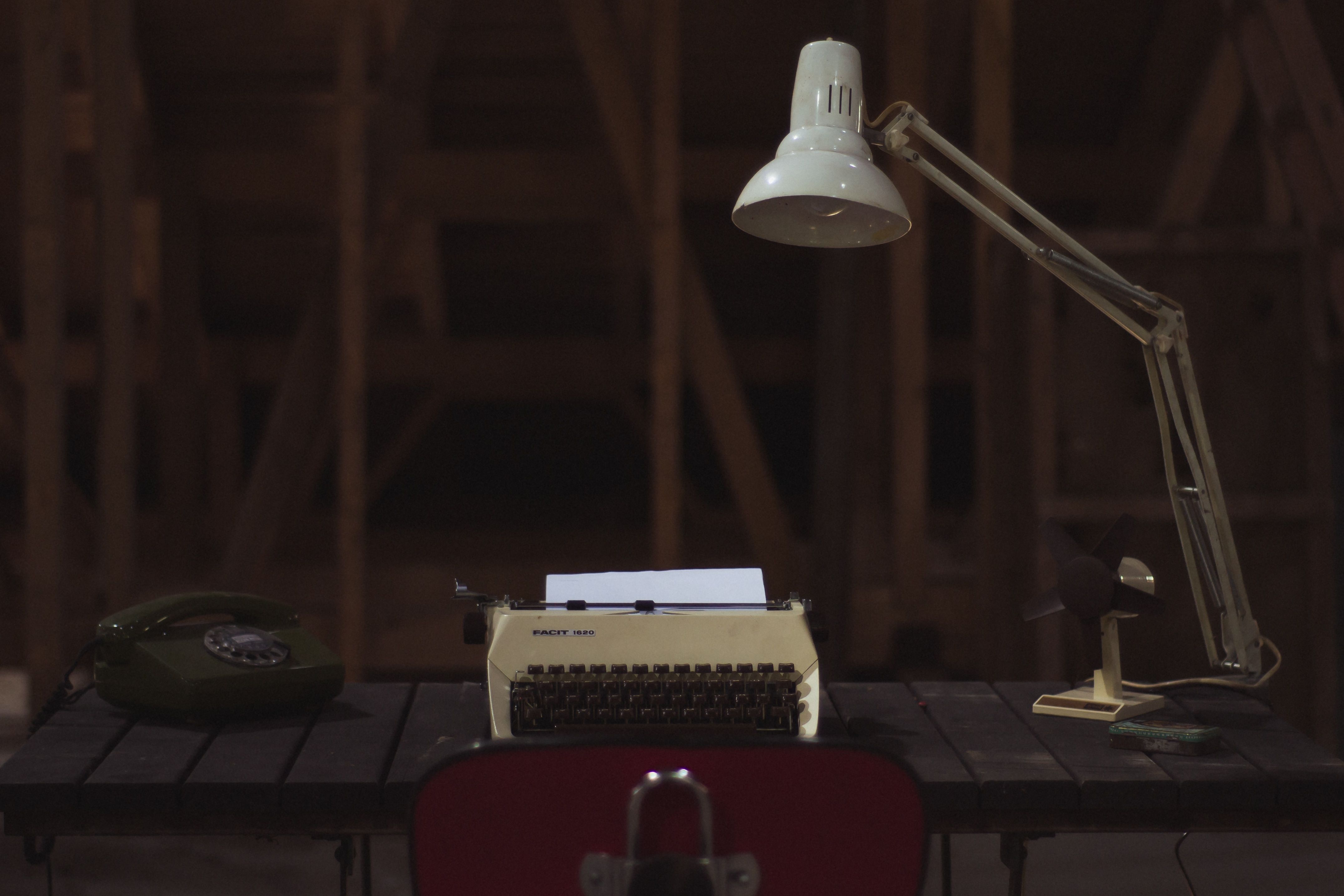 study lamp near typewriter on top table free image