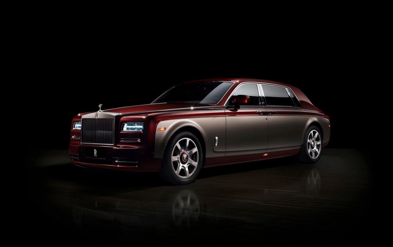 Burgundy Rolls Royce Phantom on Dark Background wallpaper. Burgundy Rolls Royce Phantom on Dark Background stock