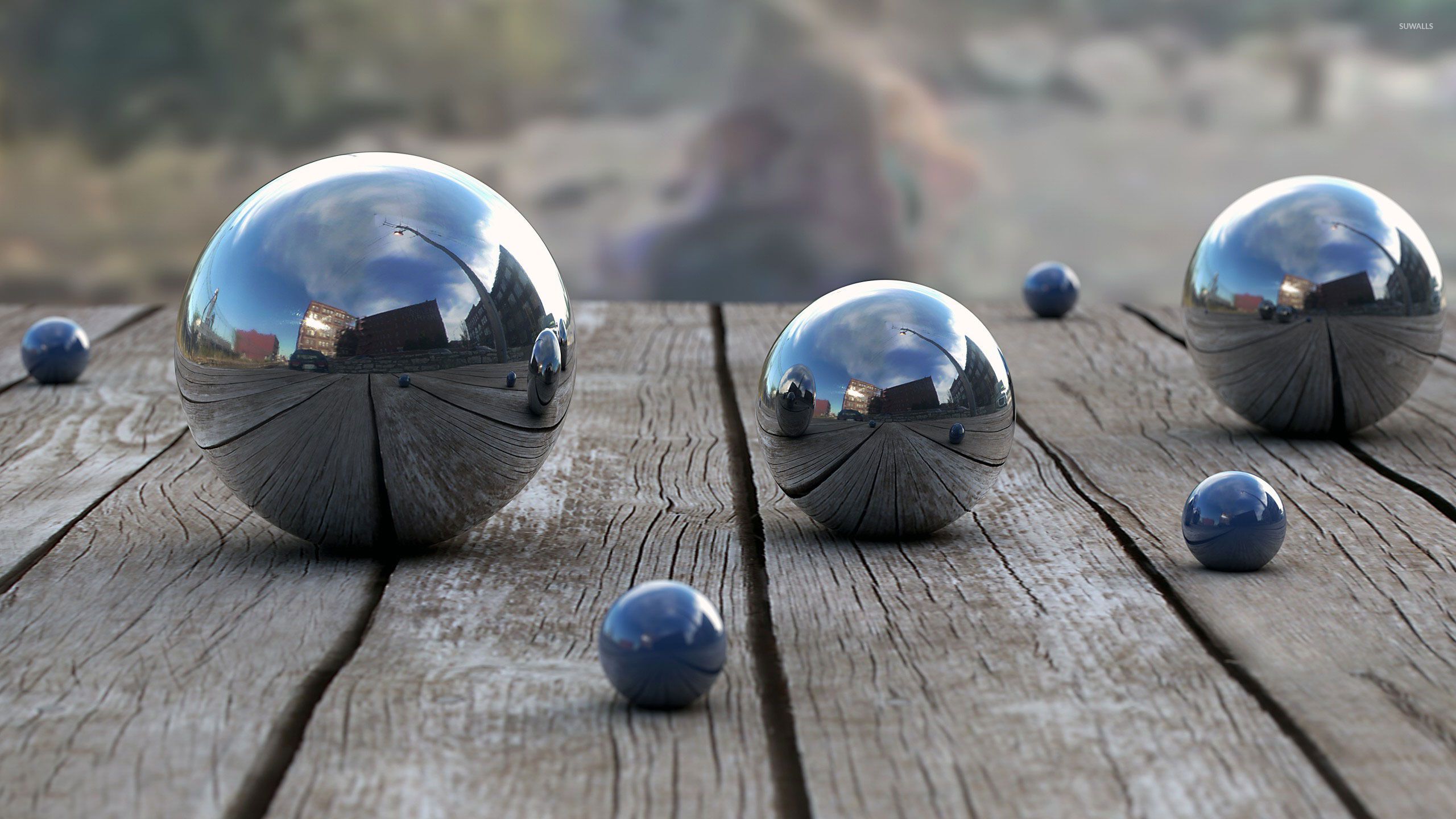 Metallic spheres reflecting the city wallpaper
