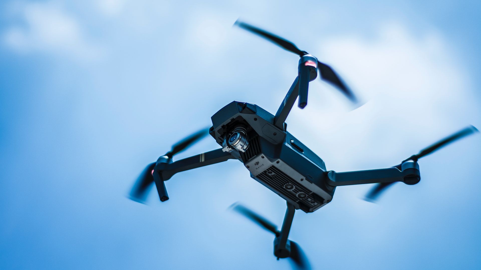 Gray Quadcopter Drone in the Sky Wallpaper