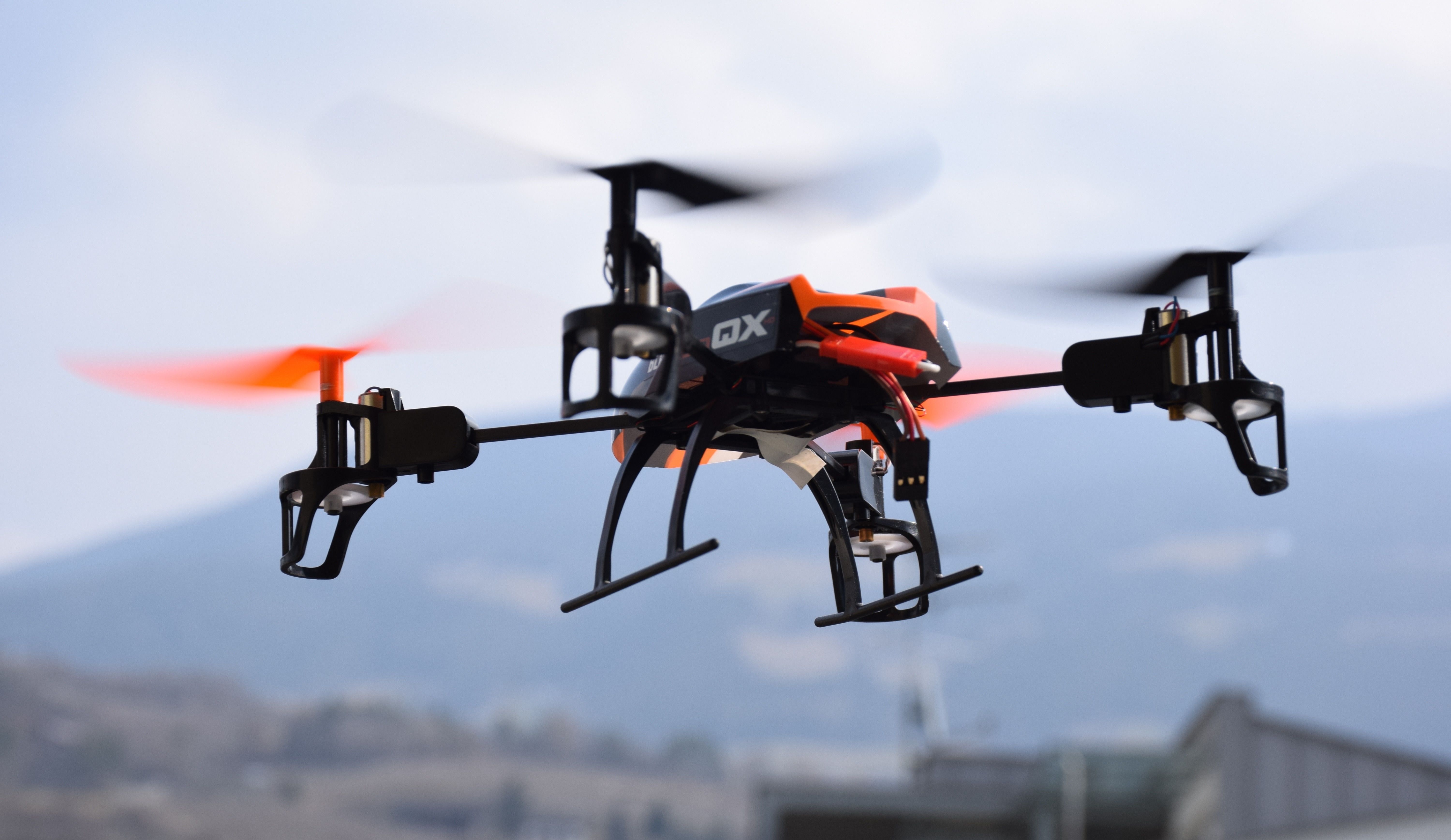 wallpaper. black orange white qx drone quadcopter
