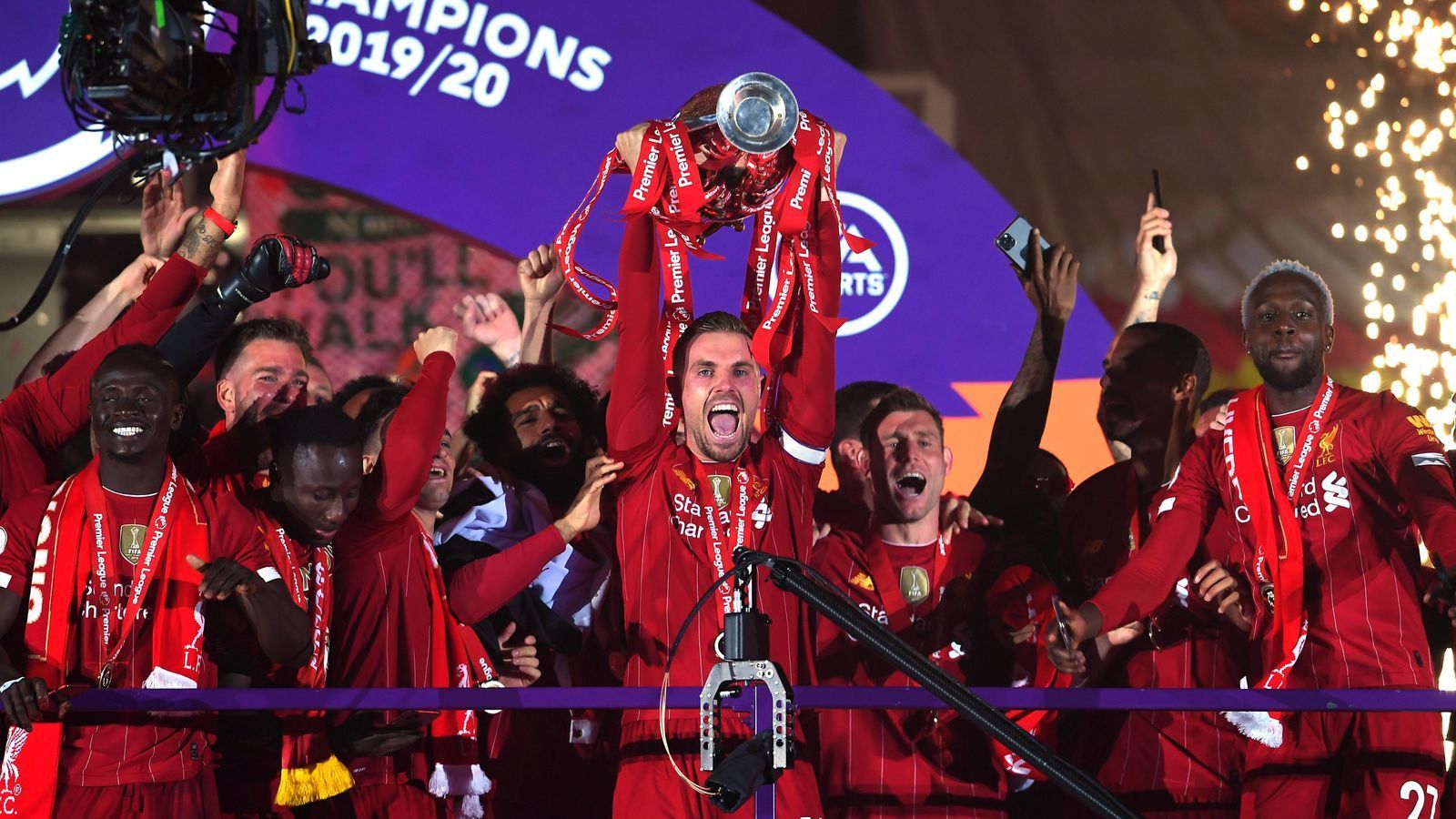 Liverpool lift Premier League trophy: Champions celebrate over Kop at Anfield after victory over Chelsea. Football News. FR24 News English