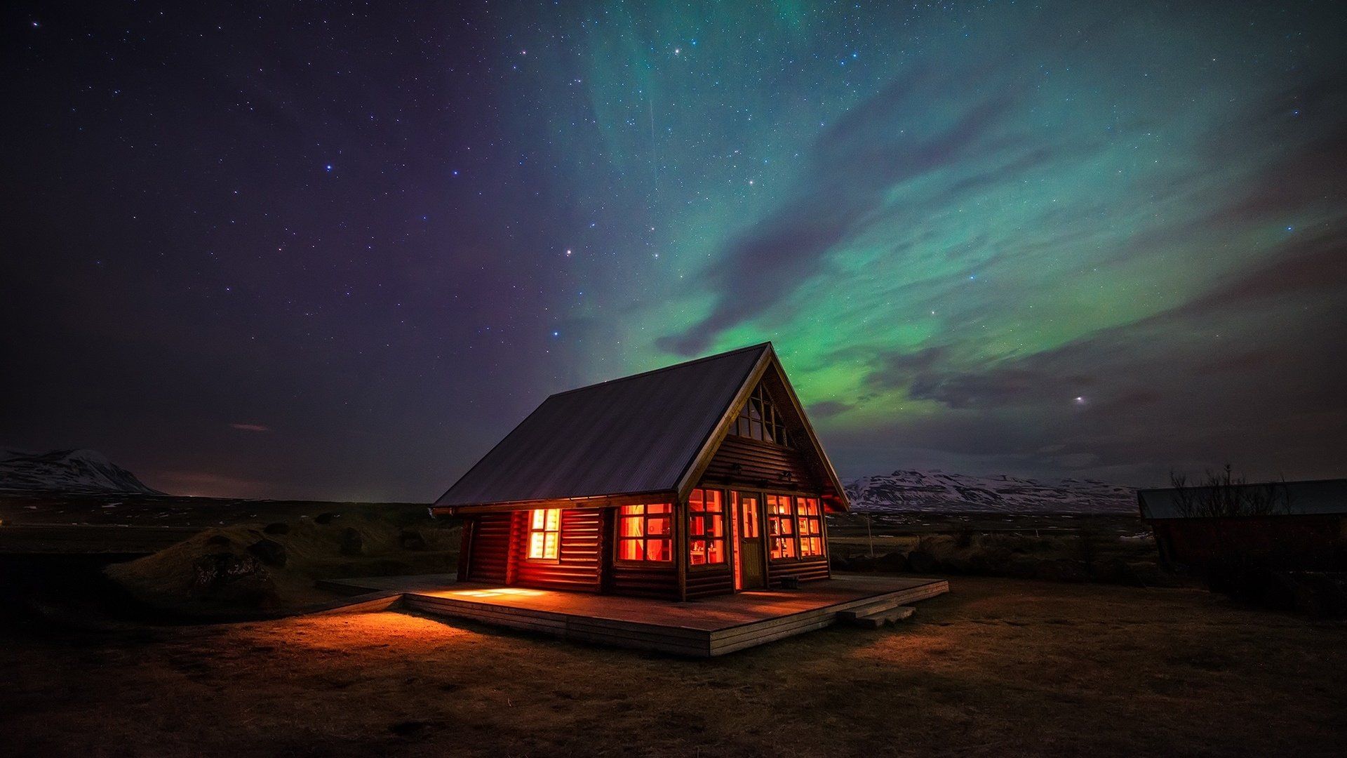 Northern Lights over Lighted House HD Wallpaper