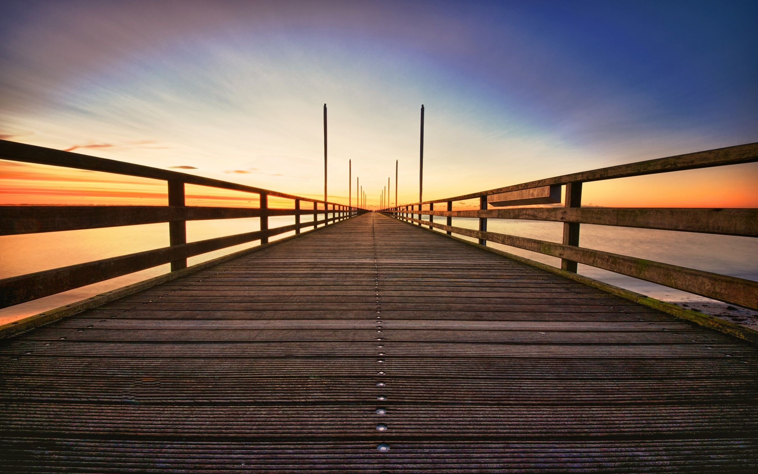 Download 2560x1600 Bridge, Sunset, Sky, Perspective, Horizon, Sea Wallpaper for MacBook Pro 13 inch