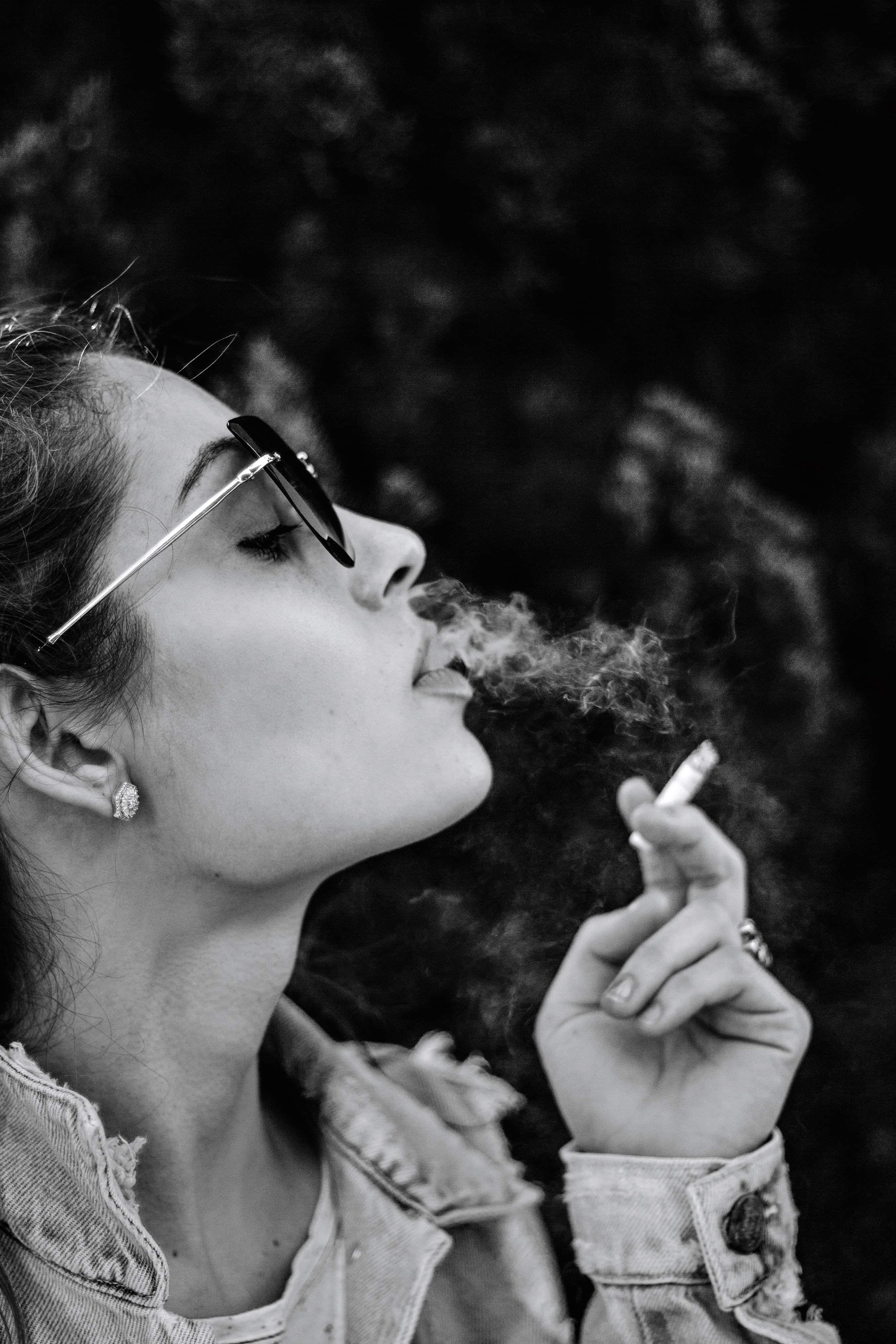 Monochrome Photo of Woman Smoking Cigarette · Free