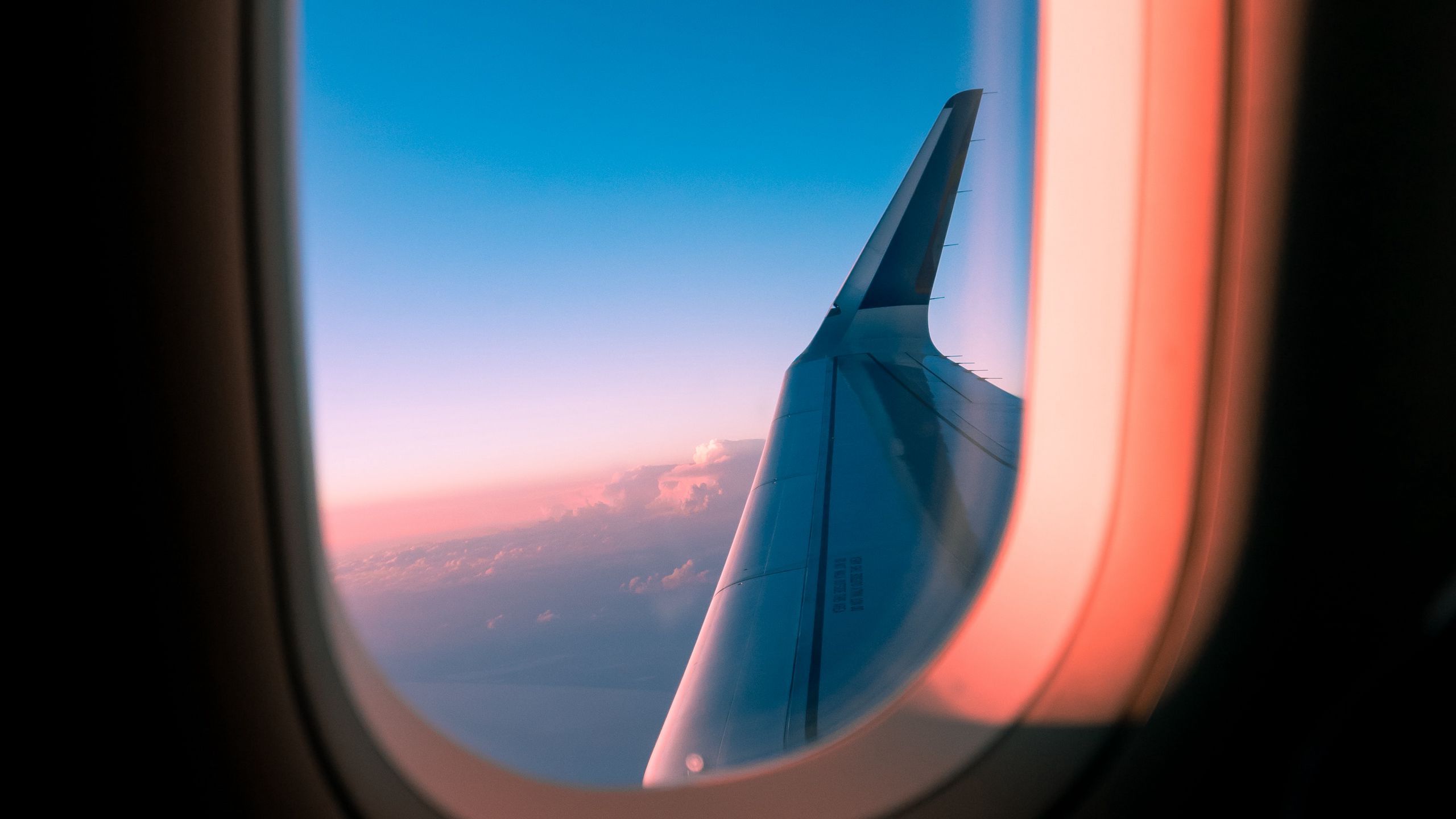 Download wallpaper 2560x1440 airplane, window, porthole, wing, view widescreen 16:9 HD background