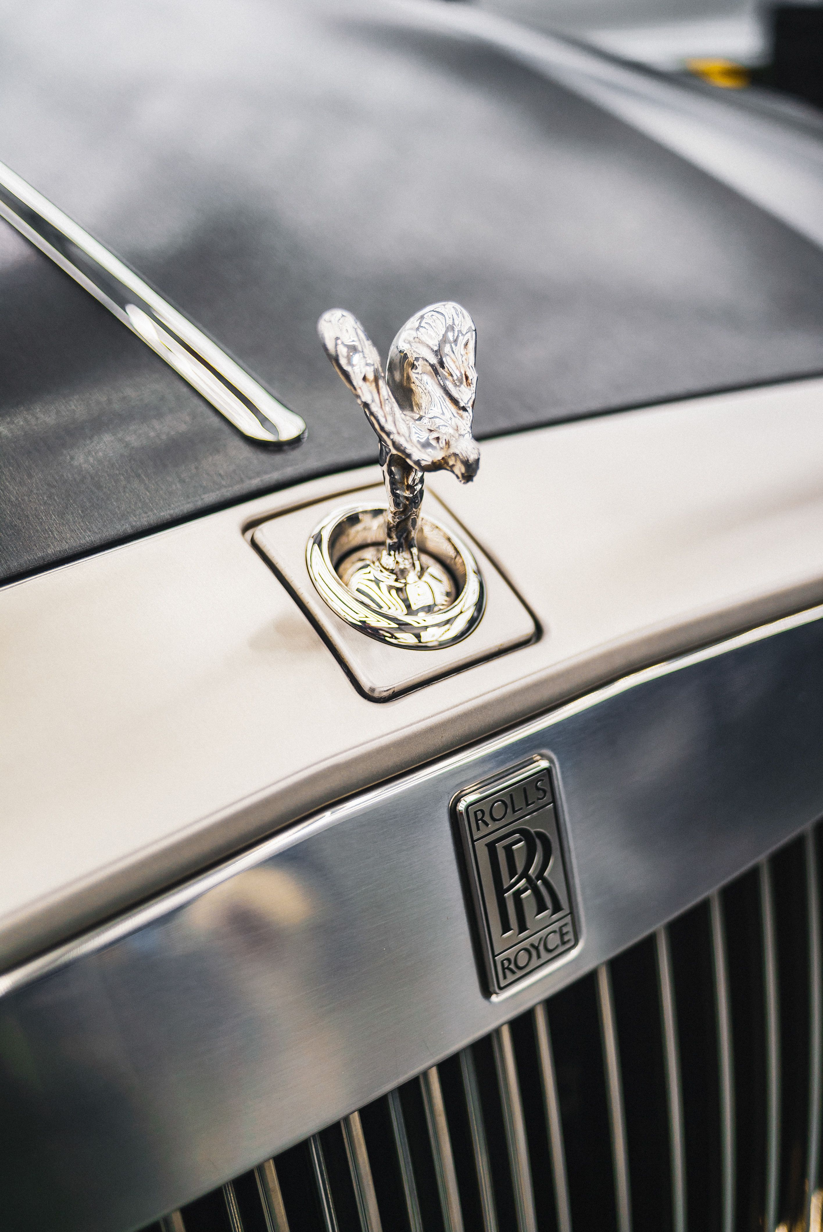 Close Up Photo Of Rolls Royce Car Emblem · Free