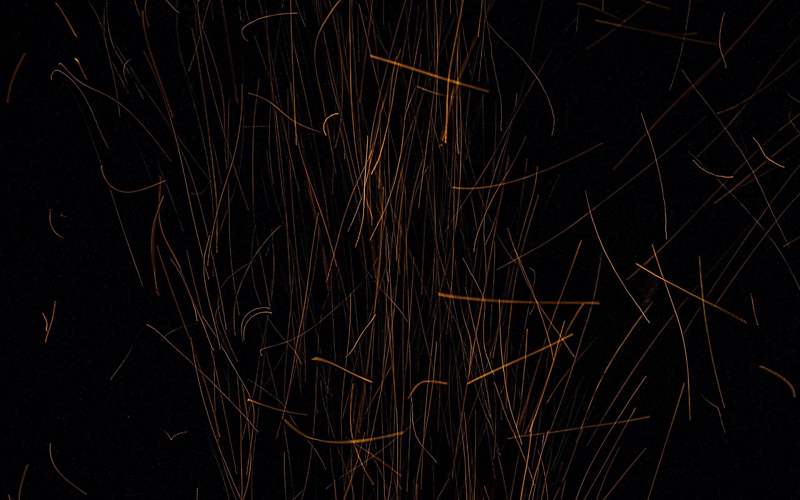 Download wallpaper 2560x1600 sparks, lines, stripes, gold, black widescreen 16:10 HD background