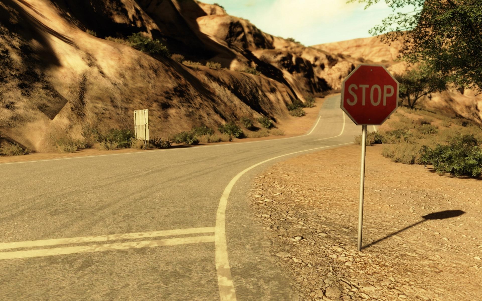 HD Stop sign on the mountain road Wallpaper