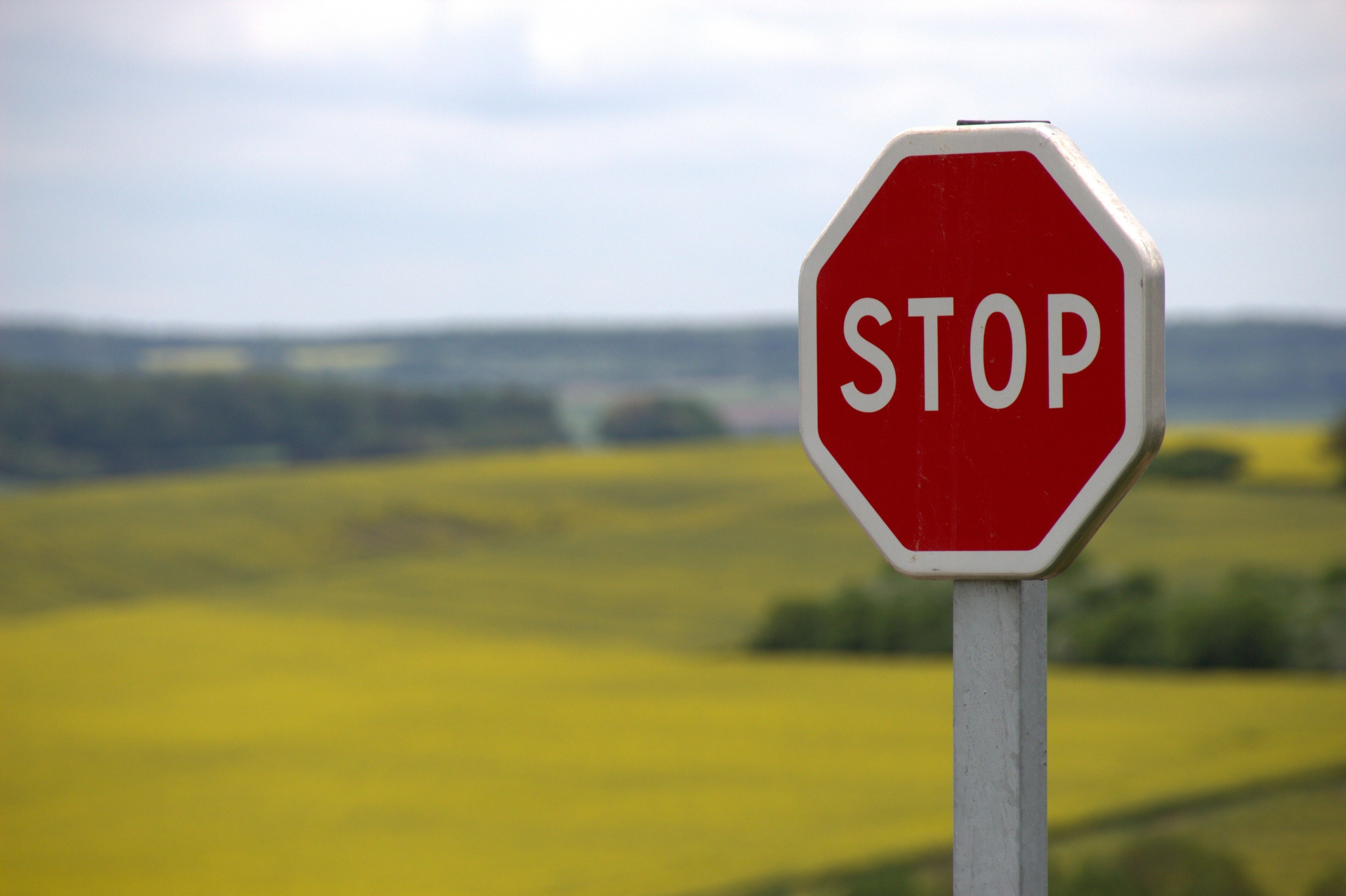 Download 5067x3376 Stop Sign, Field, Sky Wallpaper