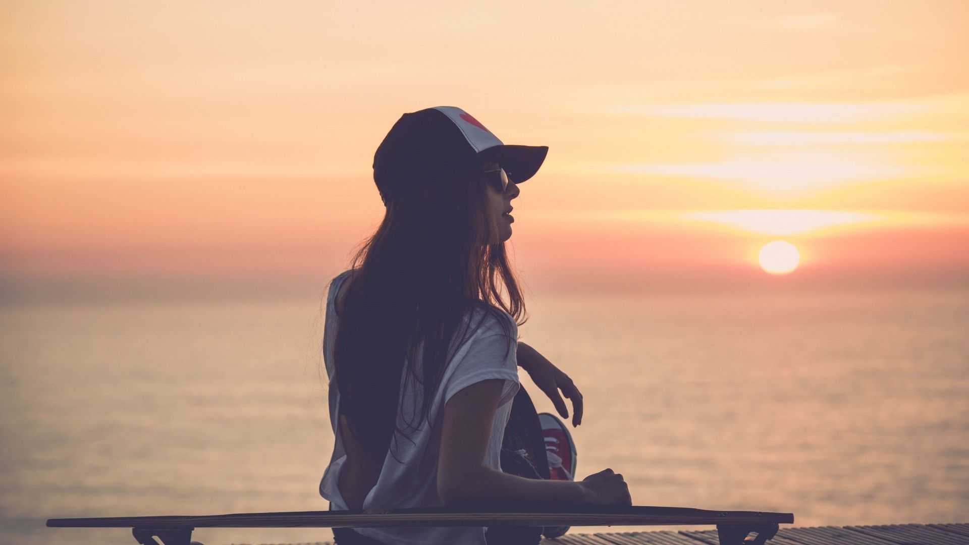 Girl watching the sunset on the beach wallpaper and image, picture, photo