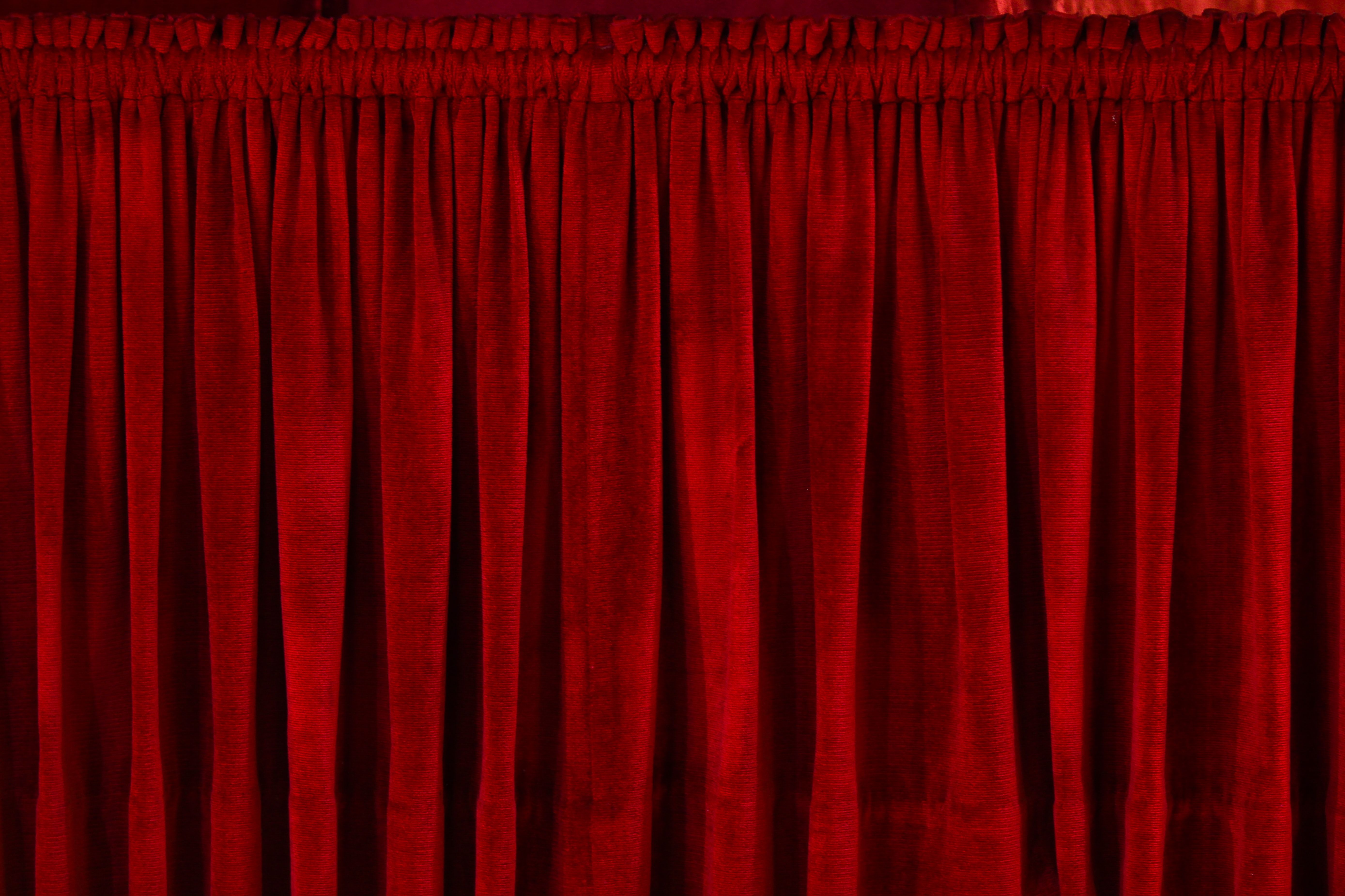 closeup photo of red rod pocket curtain photo