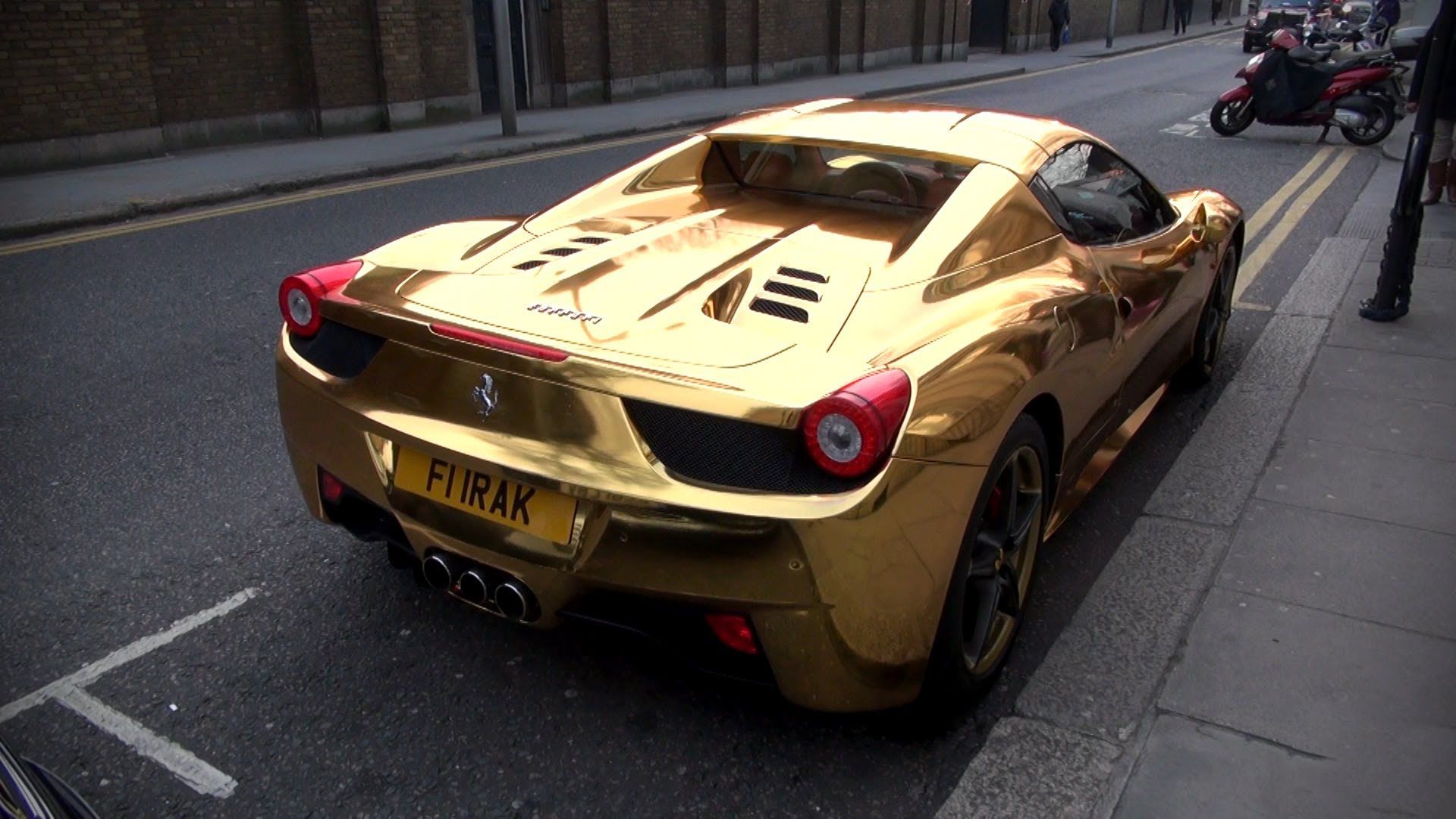 Gold Ferrari 458 Spider in a parking