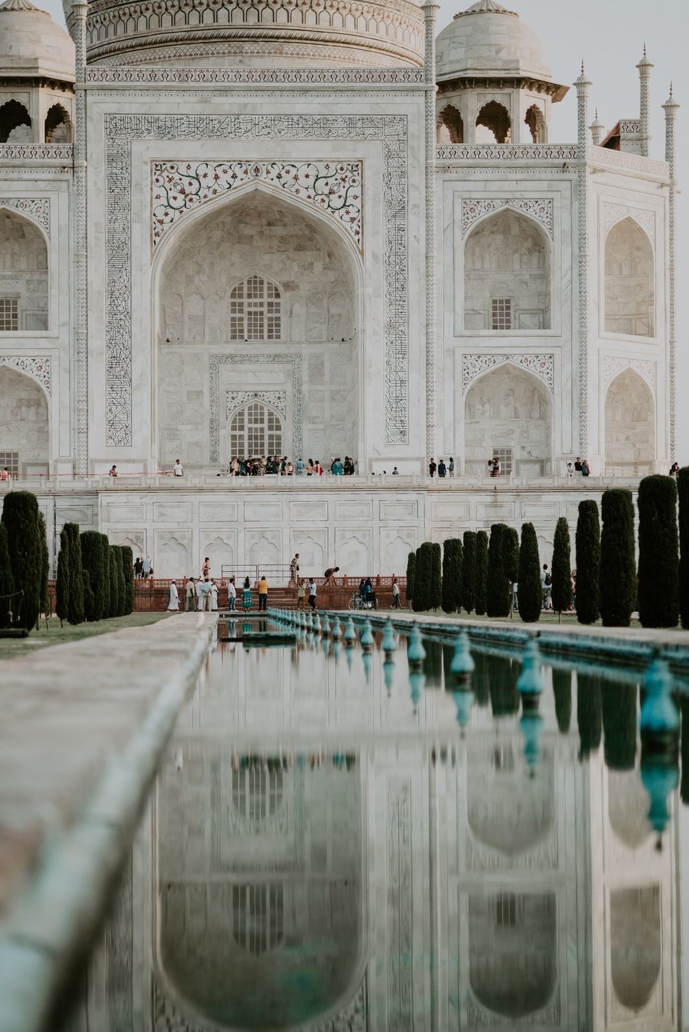 people standing in front of Taj Mahal photo