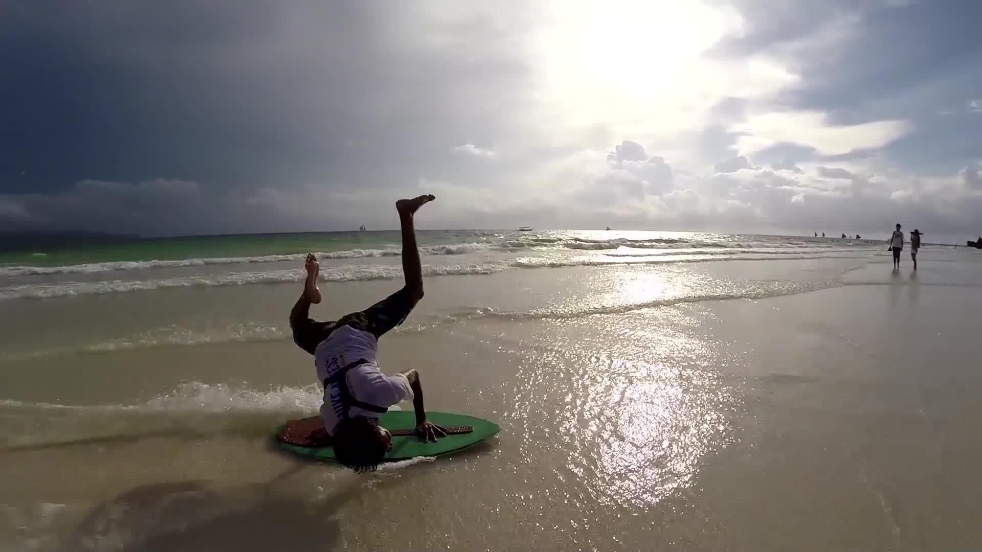 Tricks at the Beach while Skimboarding. Jukin Media Inc