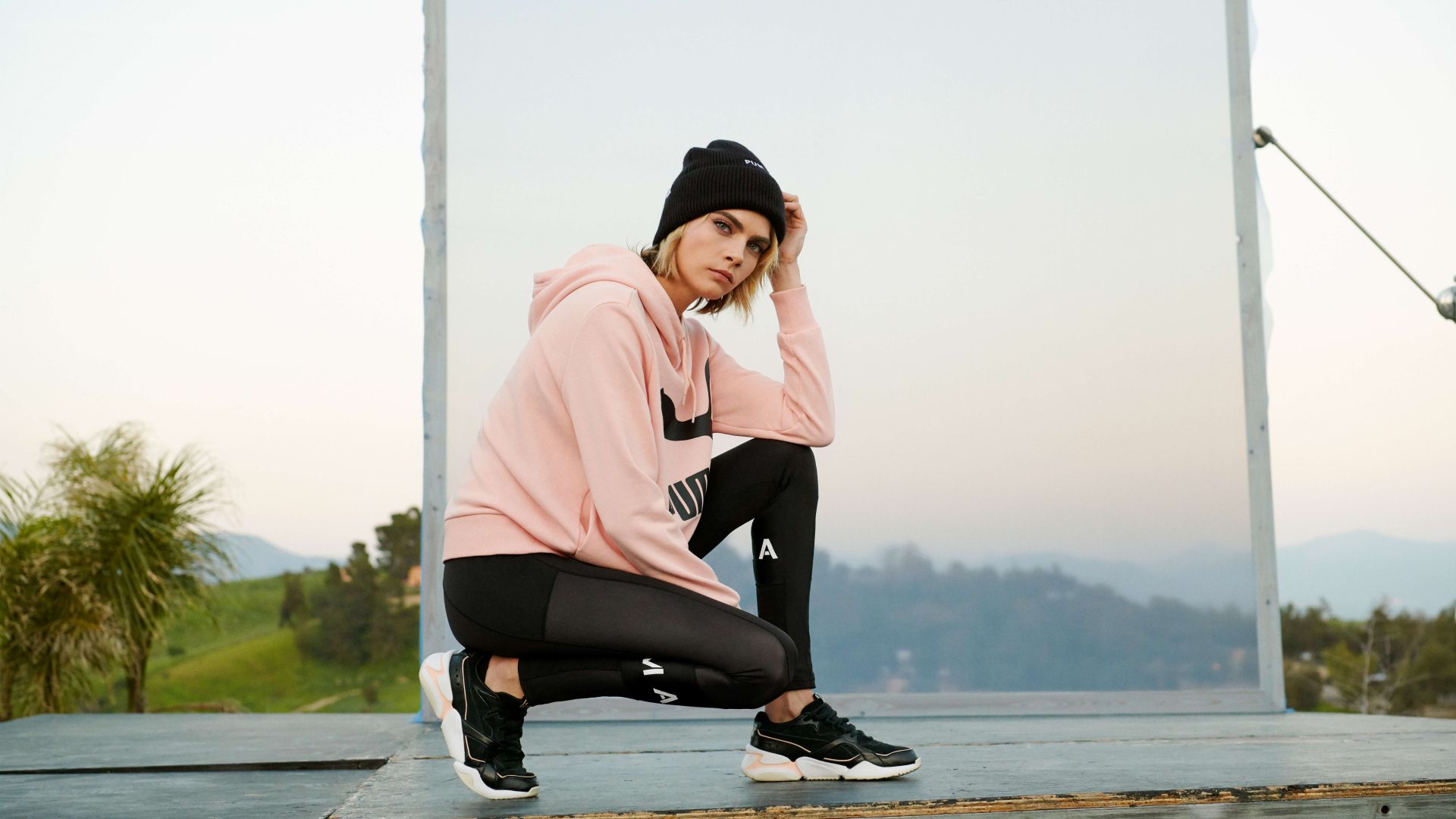 A teenager boy with a gray tracksuit turned his back, on a gray background  Stock Photo | Adobe Stock