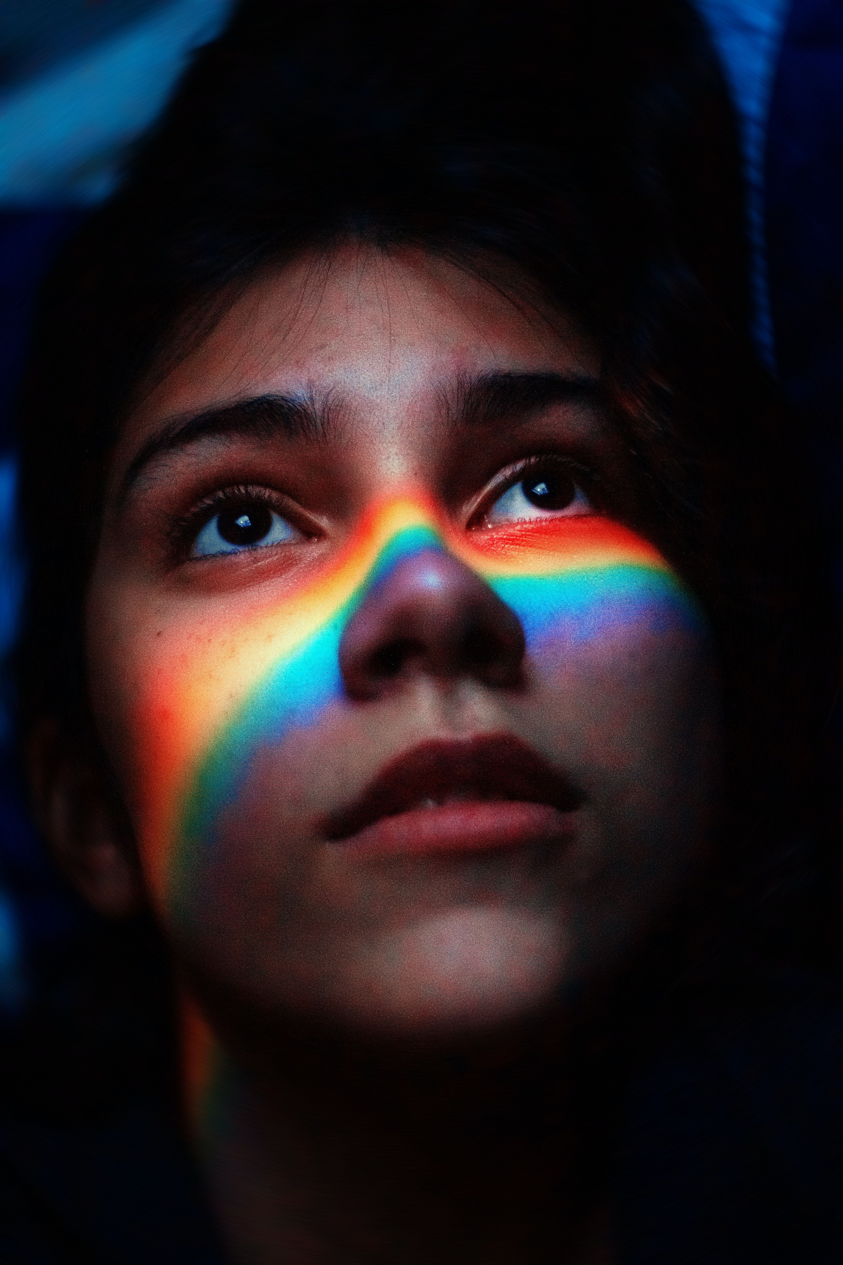 Woman With Rainbow Light Reflecting Her Face · Free